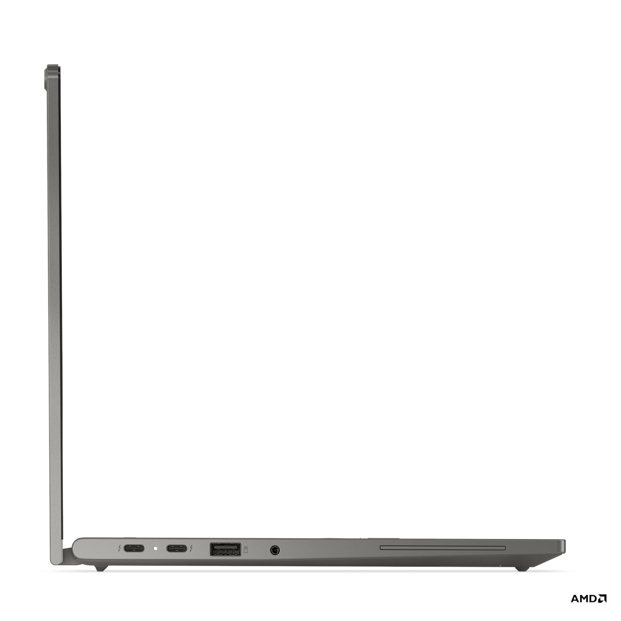 Vista laterale di un laptop grigio con porte e schermo leggermente aperto. Logo AMD in basso a destra.