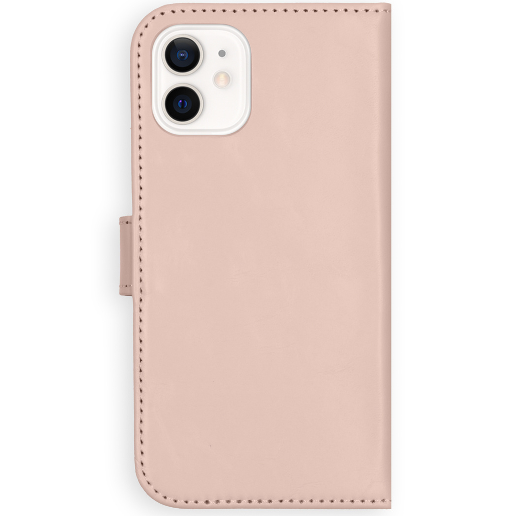Una custodia rosa per telefono con un ritaglio per la fotocamera. È in pelle e ha una chiusura magnetica.