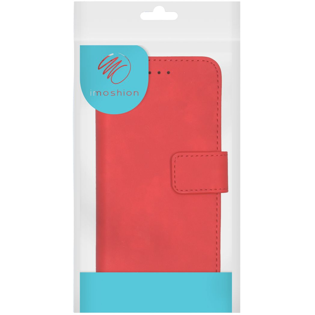 Étui de téléphone rouge dans un emballage plastique transparent. L'étui a une fermeture magnétique et la marque 'imoshion'.