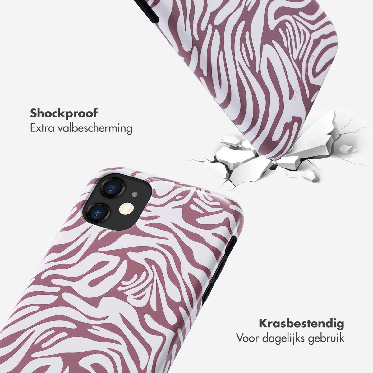 Telefoonhoesjes met een zebra-achtig design. Eén hoesje lijkt de grond te breken. Tekst zegt schokbestendig en krasbestendig.