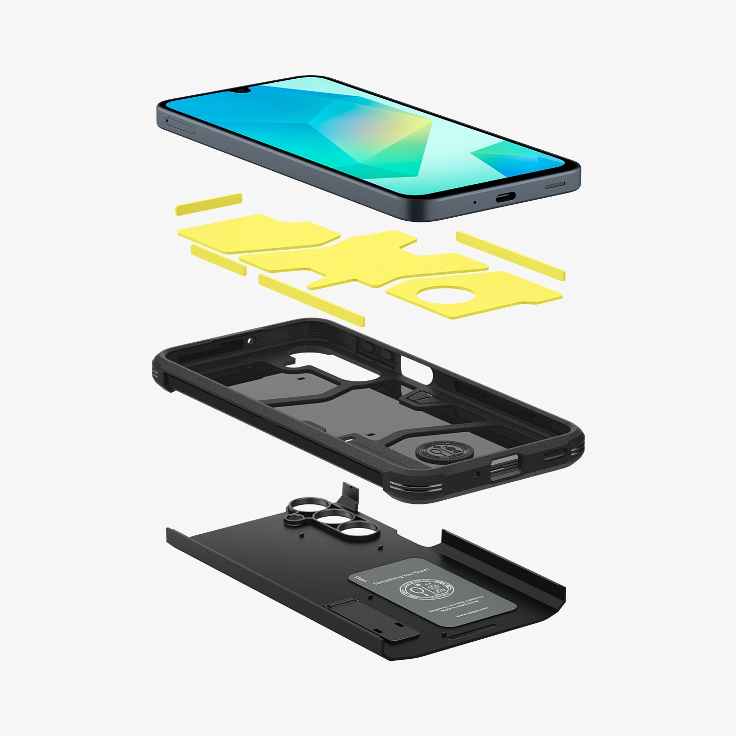 Exploded view van een telefoon en hoesje. Telefoon bovenaan, dan gele pads, een zwarte hoes en een zwart bodemstuk met ringhouder.