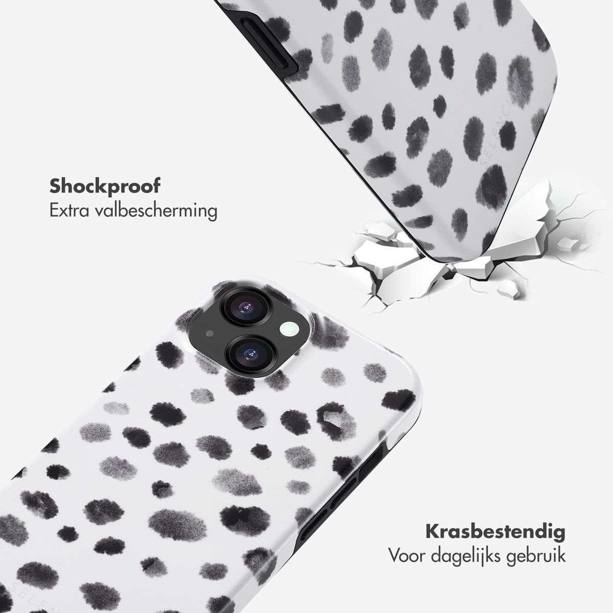 Deux coques de téléphone à pois noirs sur fond blanc. L'une tombe et brise une surface blanche. Texte sur les deux coques.