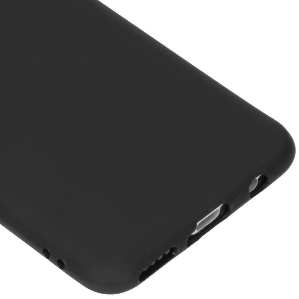 Close-up of a black phone case. The case has rounded edges, with cutouts for ports and buttons. The surface is smooth.