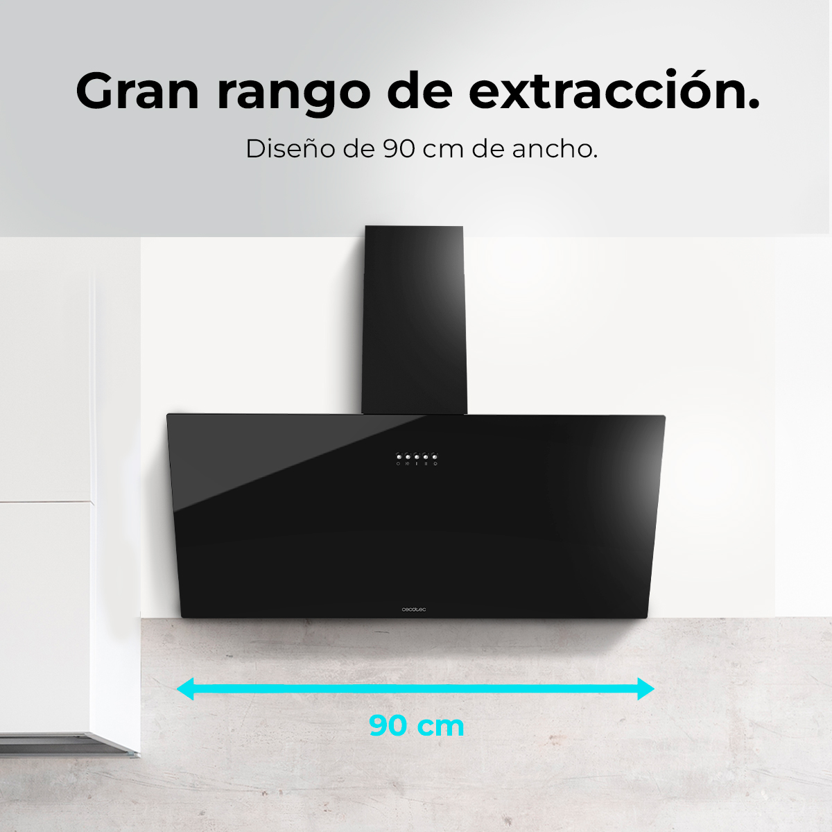 Una campana extractora negra de cocina, de 90 cm de ancho, está montada en una pared blanca. El texto superior dice: 'Gran rango de extracción.'