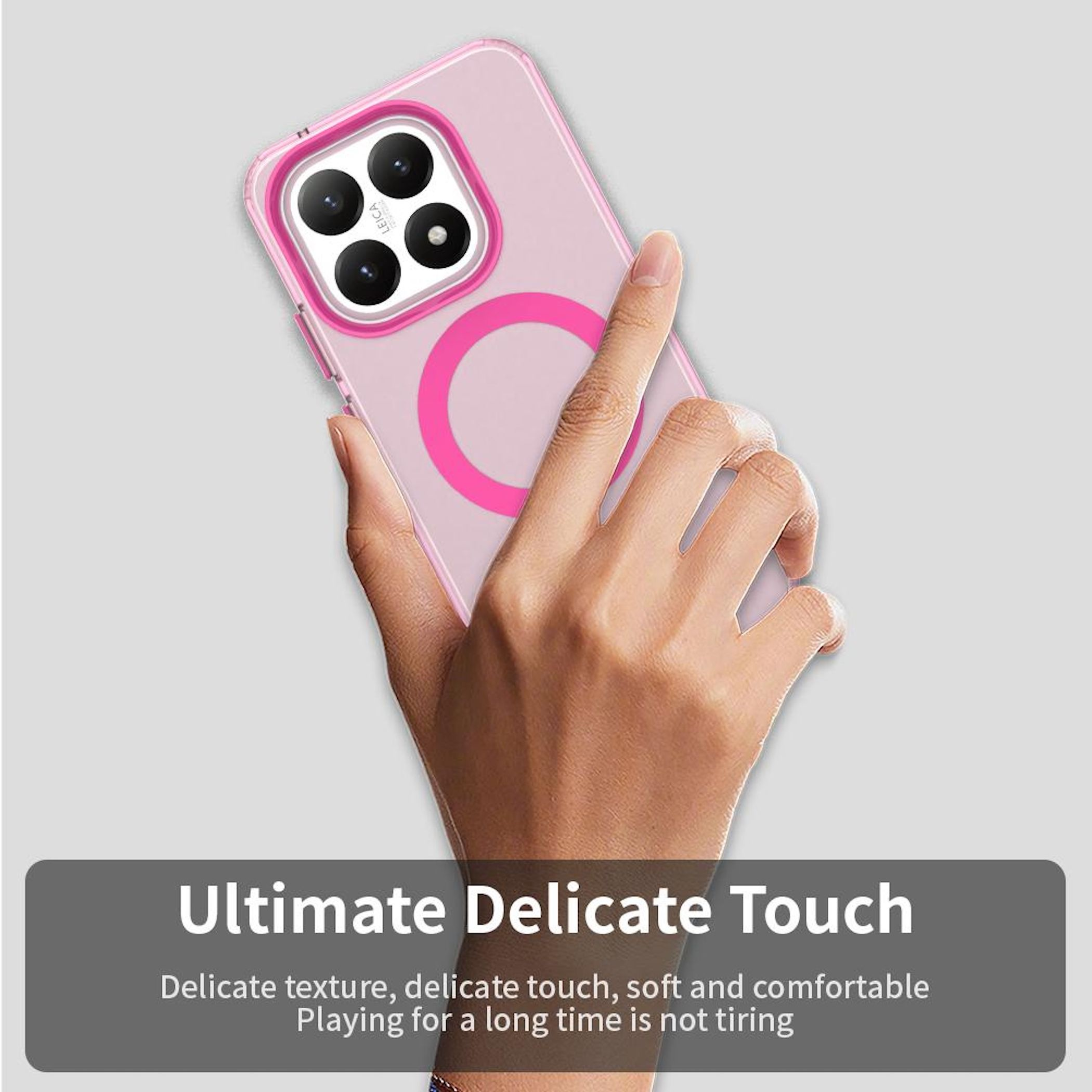 Una mano sostiene una funda rosa para teléfono con un anillo rosa. La funda tiene un recorte para la cámara. Texto: Ultimate Delicate Touch.