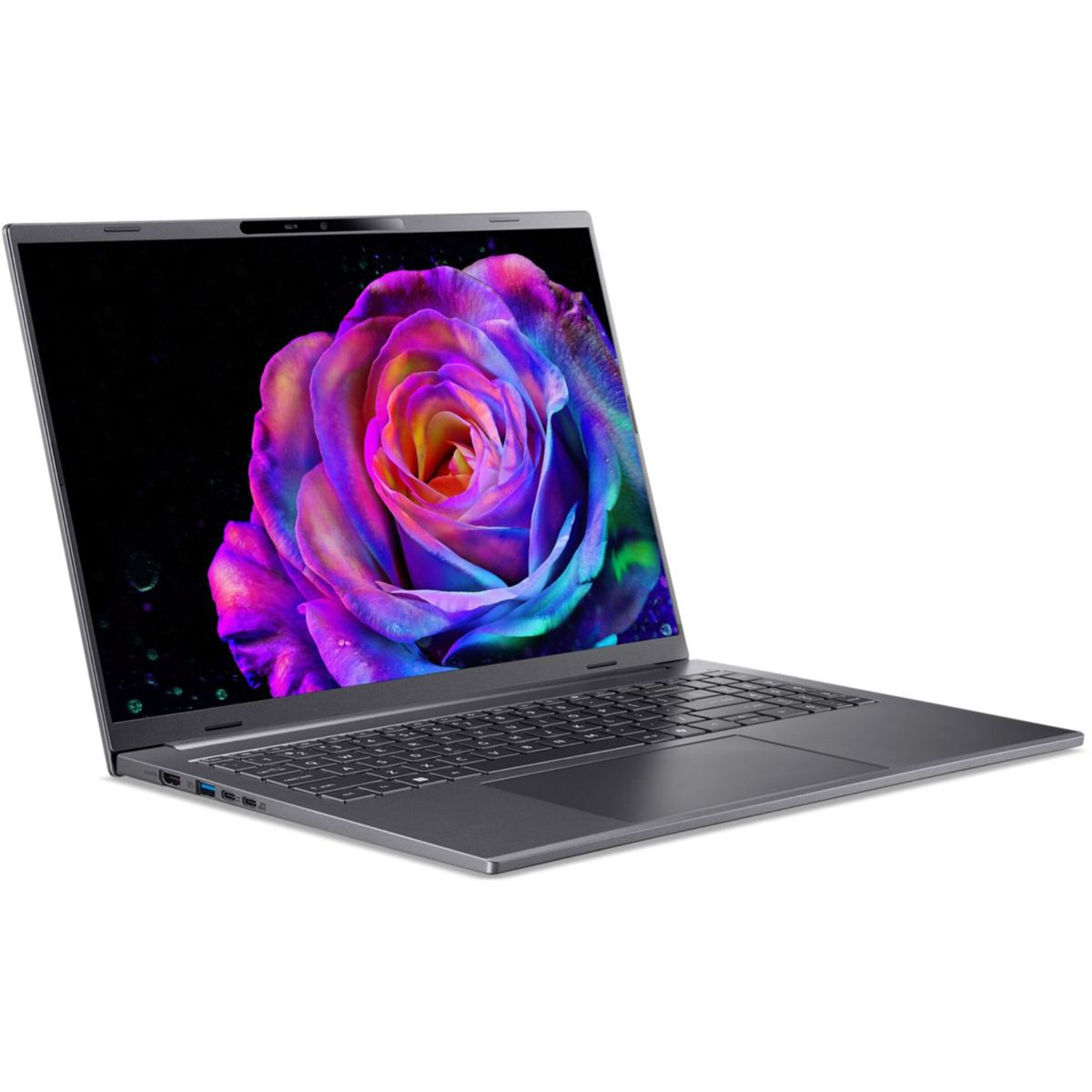 Laptop z żywym obrazem róży na ekranie, na czarnym tle. Laptop jest szary, otwarty i ustawiony pod kątem.