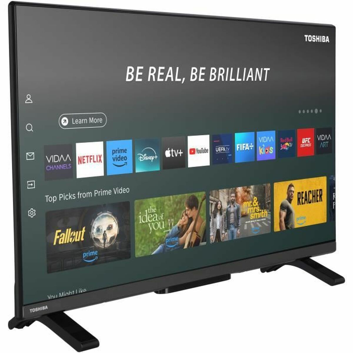 Un televisore Toshiba mostra app di streaming come Netflix e Prime Video. Lo schermo mostra contenuti promozionali e uno slogan: 'BE REAL, BE BRILLIANT'.