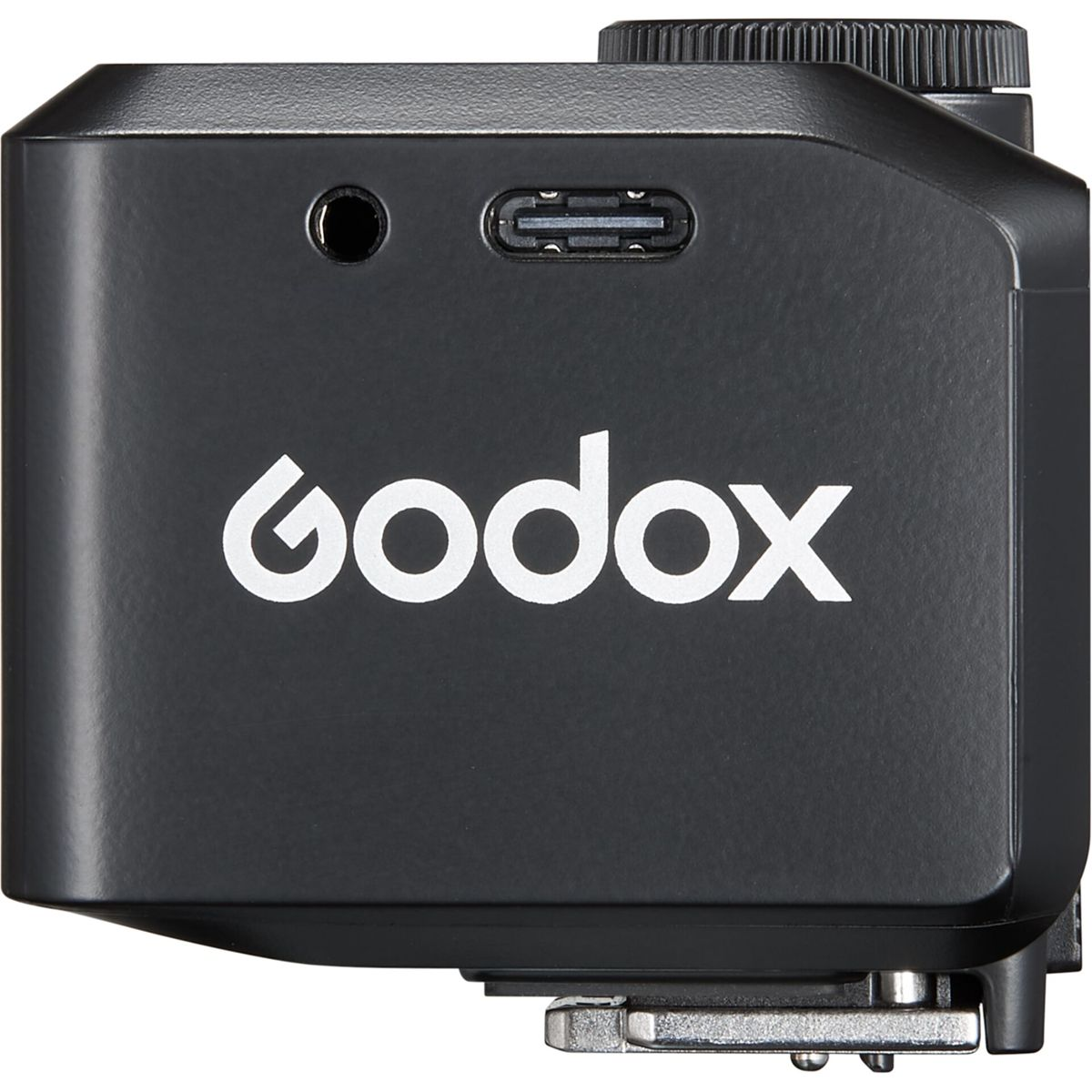 Een zwart Godox-apparaat met wit logo, een ronde poort, een USB-C-poort en een draaiknop aan de bovenkant. Een metalen basis is zichtbaar aan de onderkant.