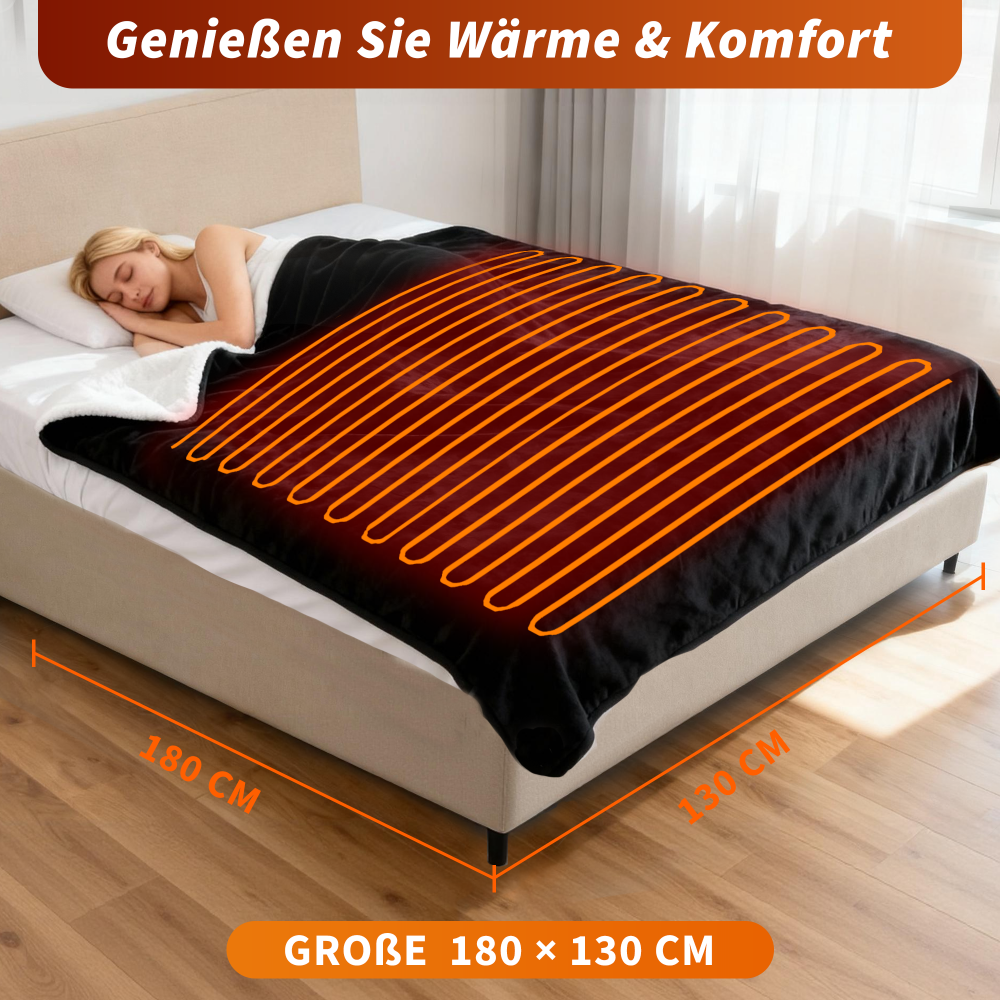 Una donna dorme sotto una coperta elettrica nera su un letto. La coperta ha elementi riscaldanti arancioni.