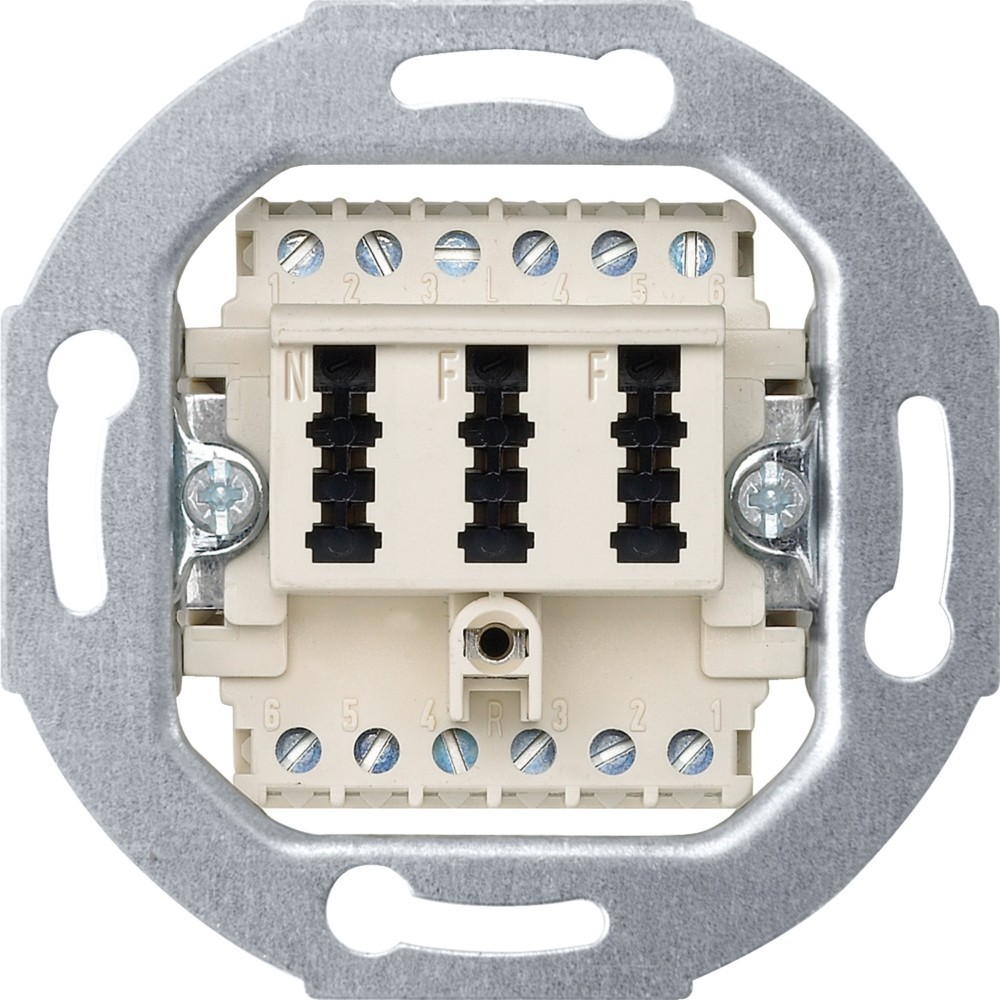 Componente di un interruttore elettrico. Ha punti di connessione numerati, terminali neri e un telaio metallico per il montaggio. Plastica beige.