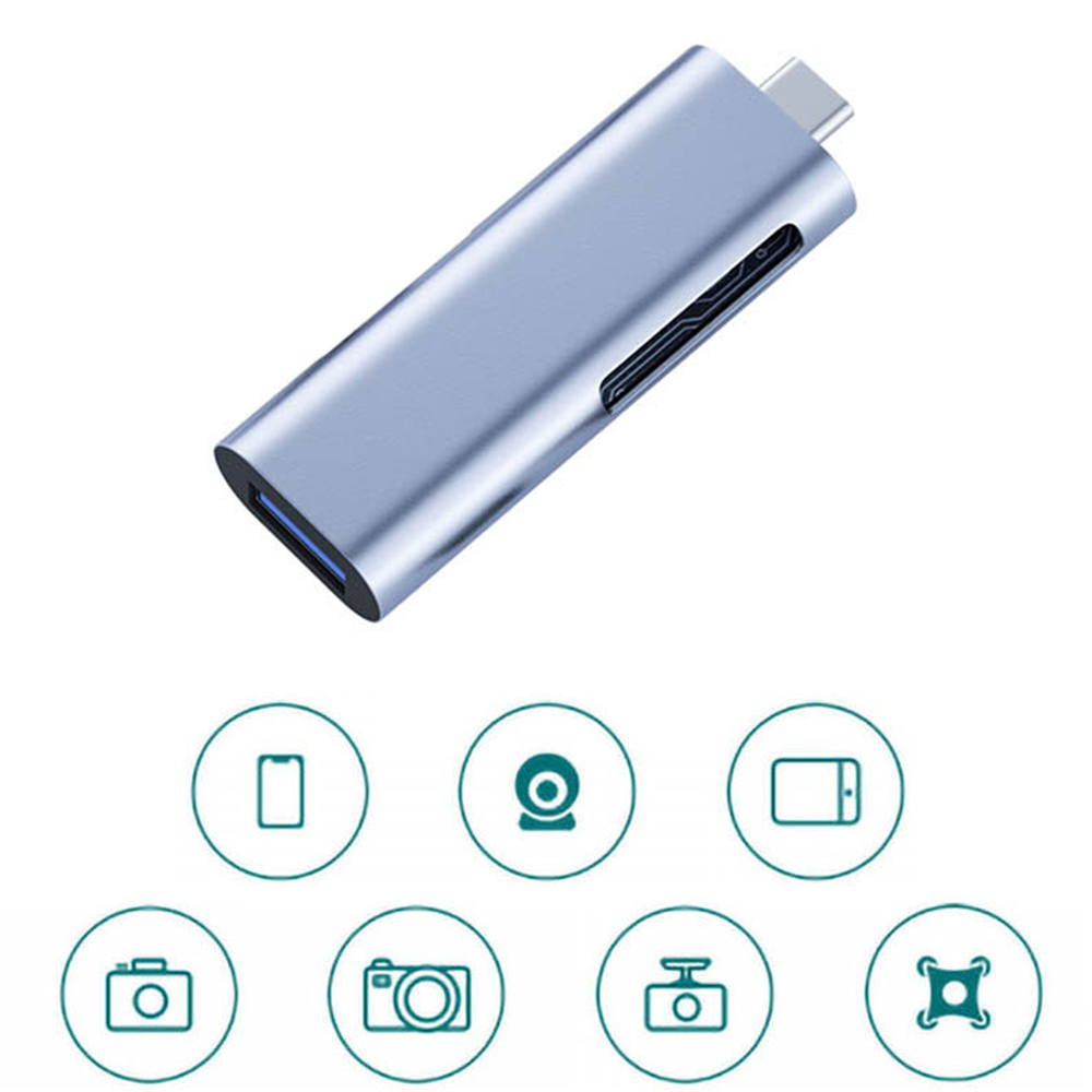 Ein silberner USB-C-Adapter mit verschiedenen Symbolen darunter, darunter ein Telefon, eine Webcam, ein Tablet und eine Kamera.