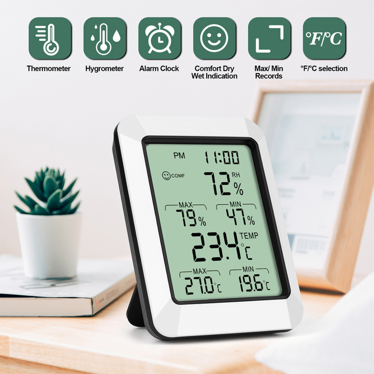 Eine weiße digitale Wetterstation zeigt Zeit, Luftfeuchtigkeit und Temperatur an. Symbole für Thermometer, Alarm und Komfort sind vorhanden.