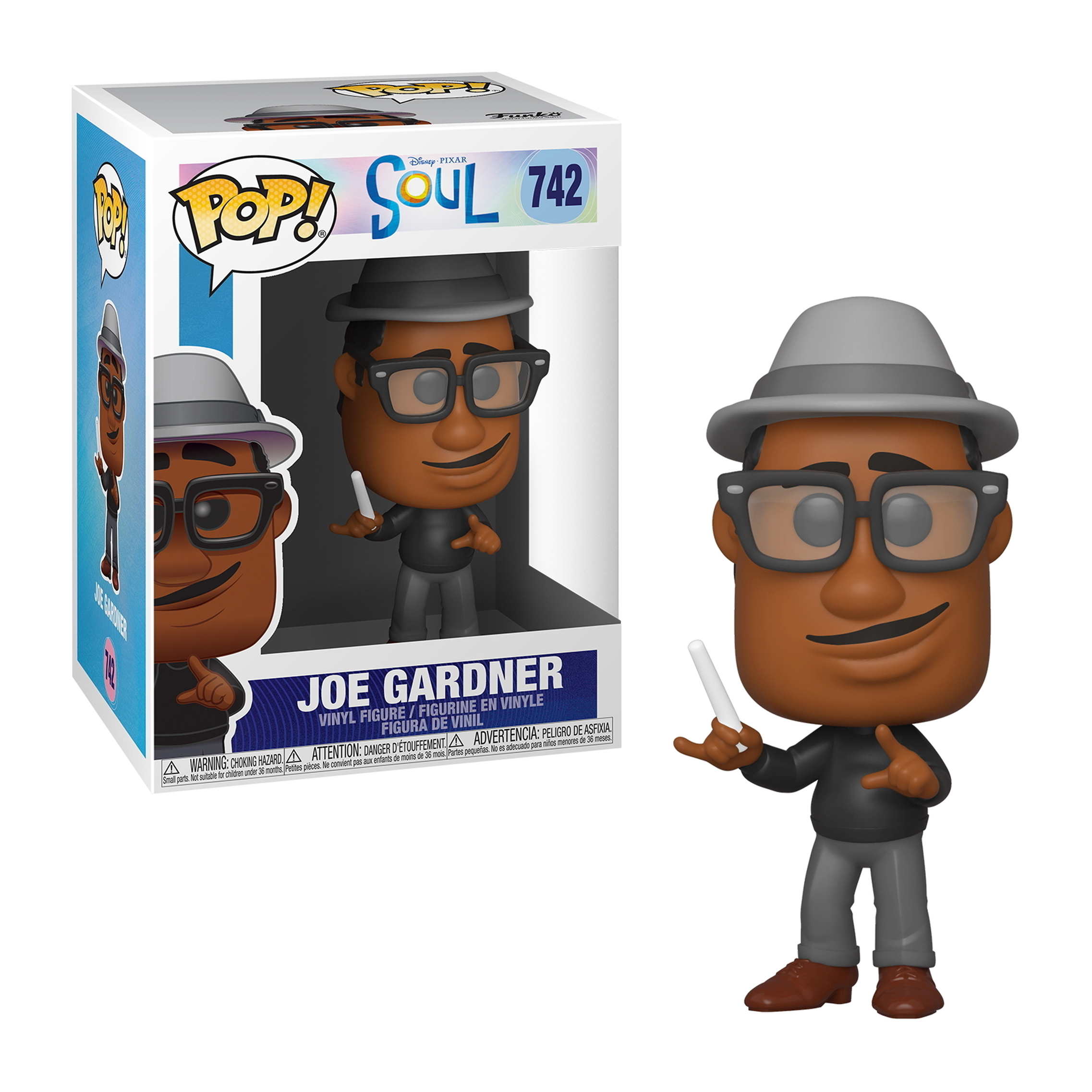 Eine Joe Gardner Funko Pop Figur. Er trägt eine Brille, einen Hut und ein schwarzes Hemd. Die Box ist hinter ihm.