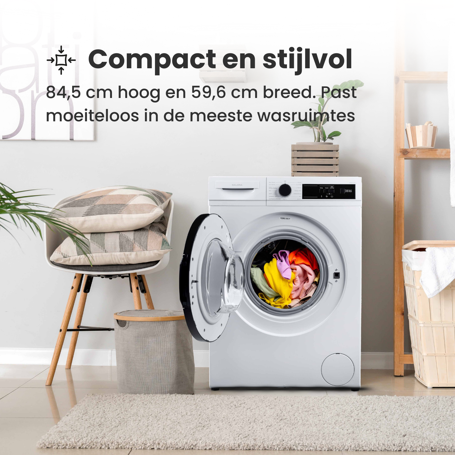 A white washing machine with an open door. Inside are colorful clothes. There's a chair with pillows, and a rug.