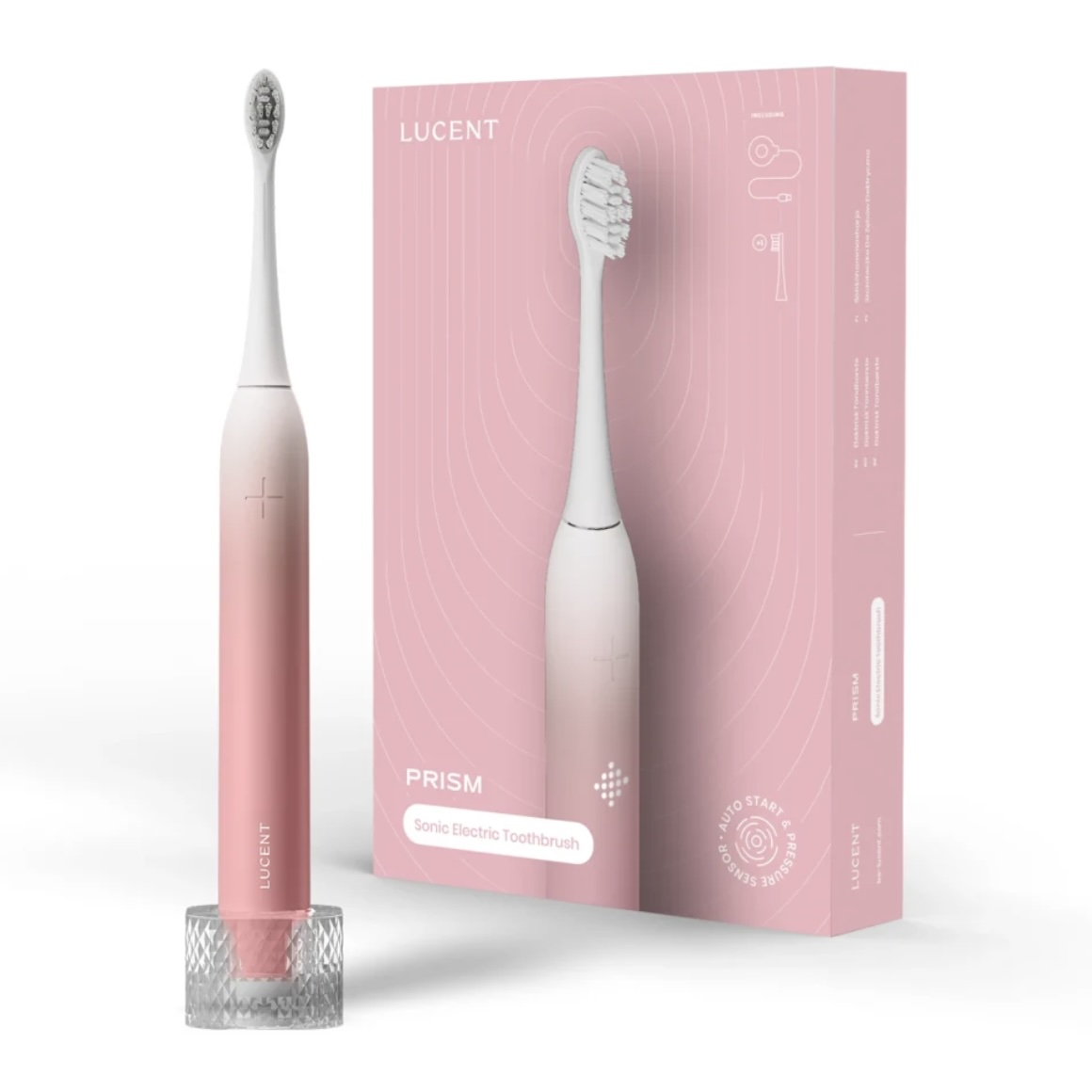 Spazzolino elettrico rosa e bianco con base di ricarica e scatola. La scatola dice 'LUCENT PRISM' e 'Sonic Electric Toothbrush'.