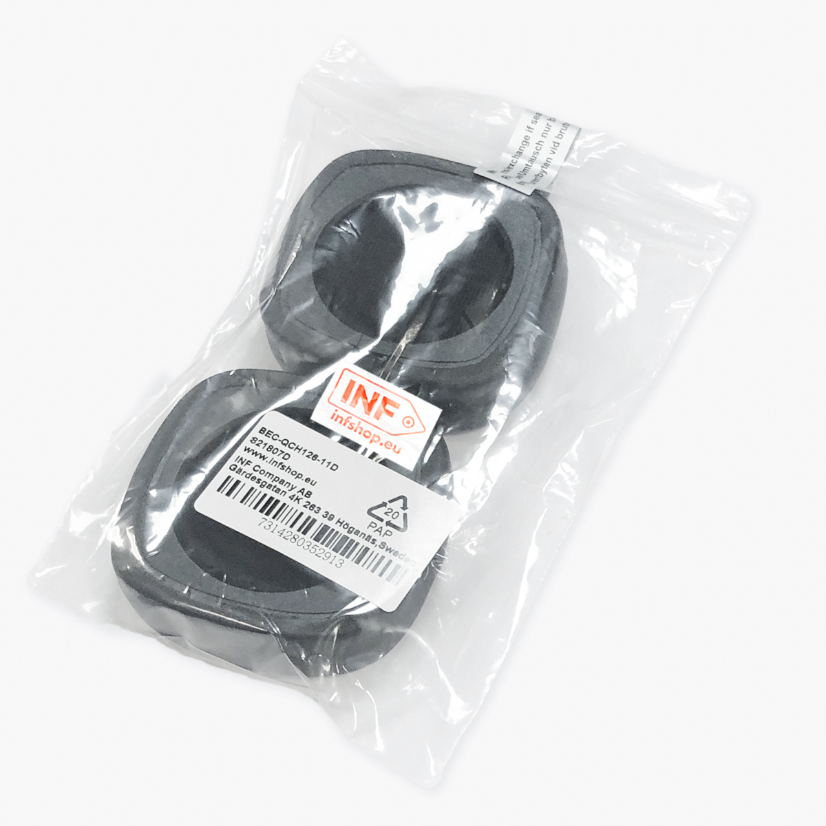 Dwie czarne gumowe uszczelki znajdują się w przezroczystej plastikowej torbie. Etykieta z tekstem i logo jest widoczna na torbie. Tło jest białe.