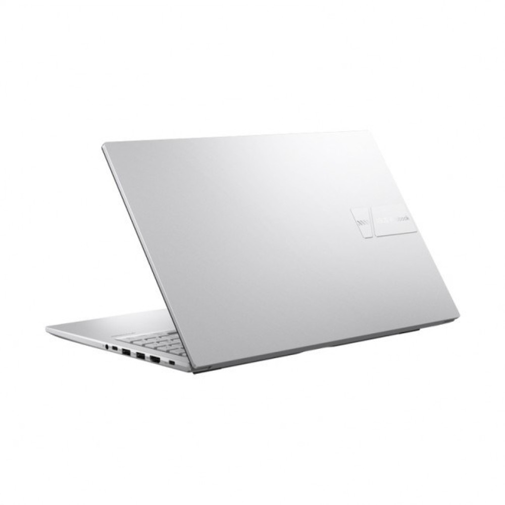 Srebrny laptop jest lekko otwarty, ukazując klawiaturę i porty. Logo ASUS Vivobook znajduje się na pokrywie.