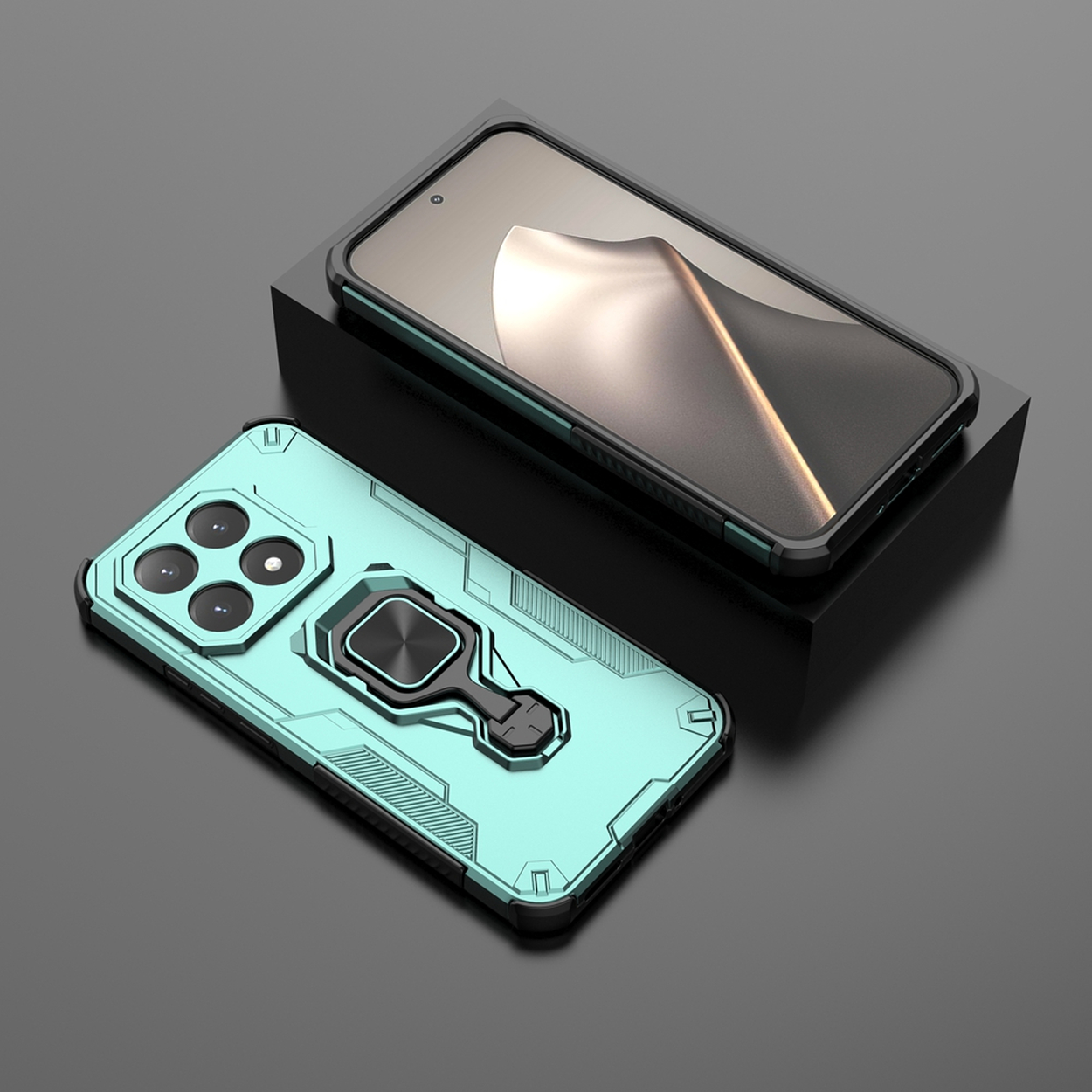 Twee telefoonhoesjes. Eén op een zwart blok, de andere eronder. Beide zijn blauwgroen. De bovenste heeft een zwart frame.