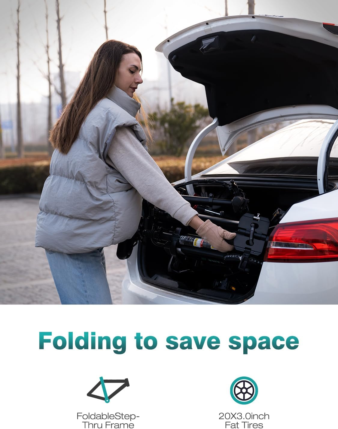 A woman loads a folded mobility device into a car trunk. The device is black, and the car is white. Text says "Folding to save space."