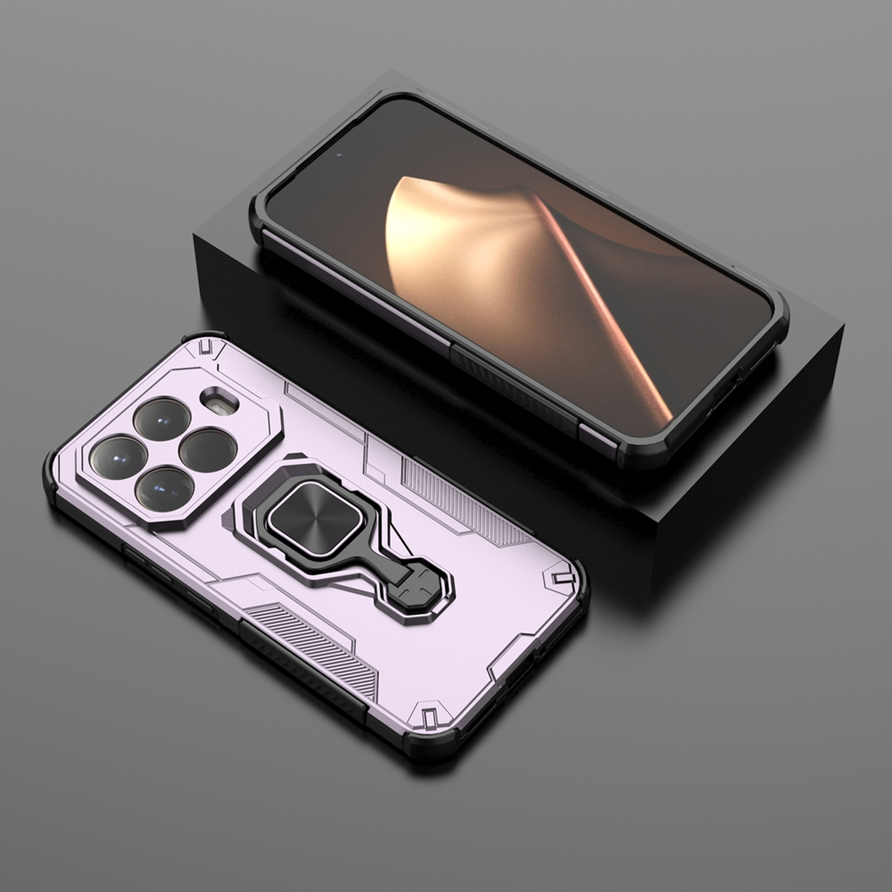 Twee smartphones, één in een zwarte hoes op een zwart blok, de andere in een roze hoes met een ringhouder, op een donkere ondergrond.