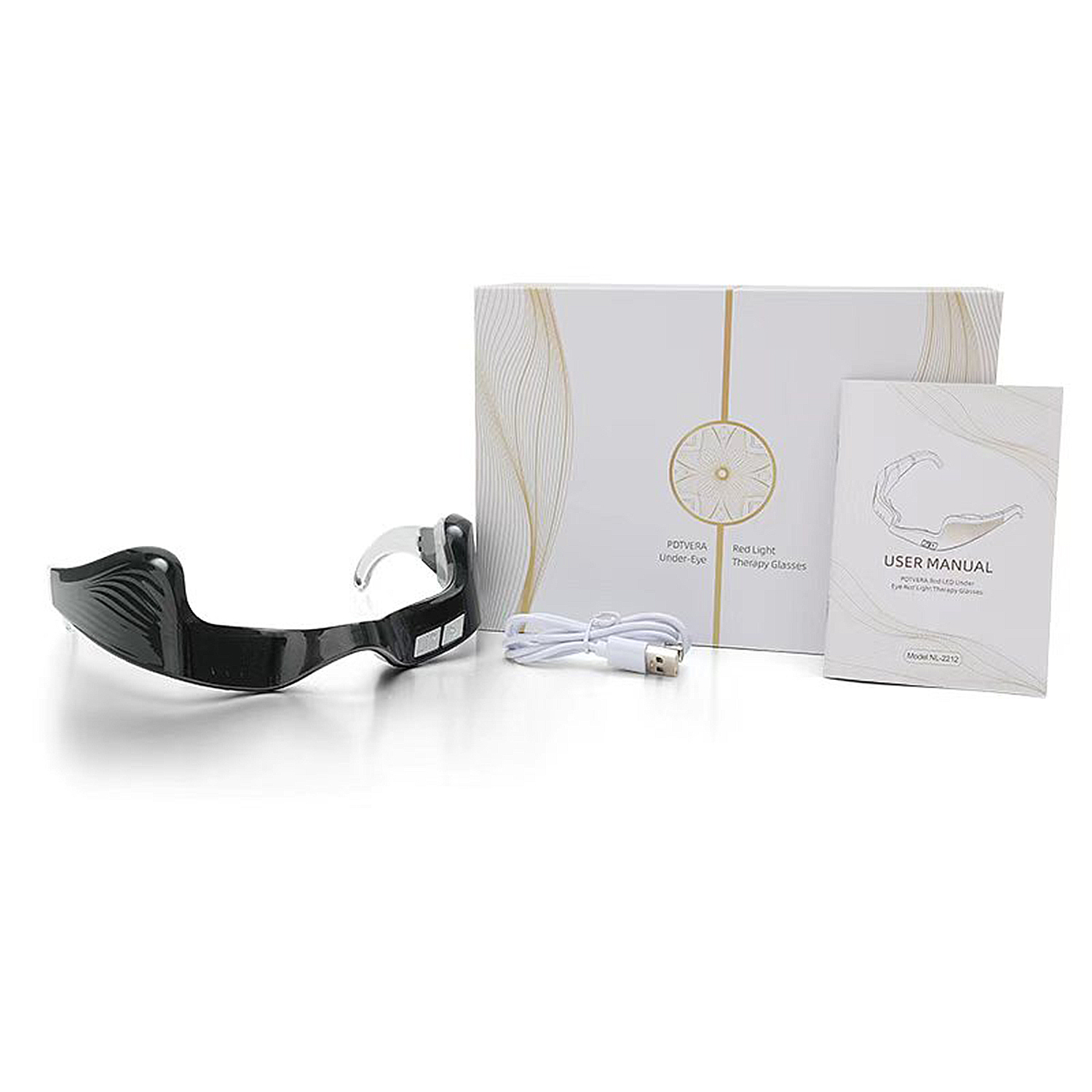 Un dispositivo negro de terapia ocular con un cable de carga blanco, una caja blanca y un manual de usuario sobre una superficie blanca.