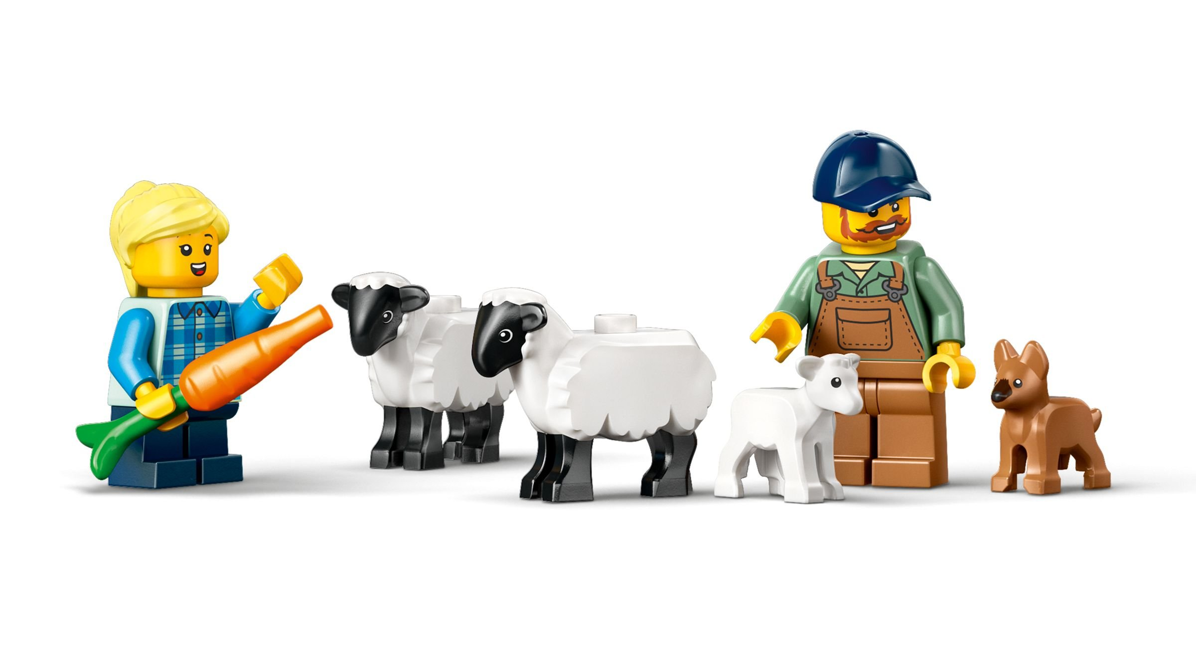 Eine Lego-Szene zeigt einen Bauern, Schafe, ein Lamm, eine Frau und einen Hund. Die Frau hält eine Karotte.