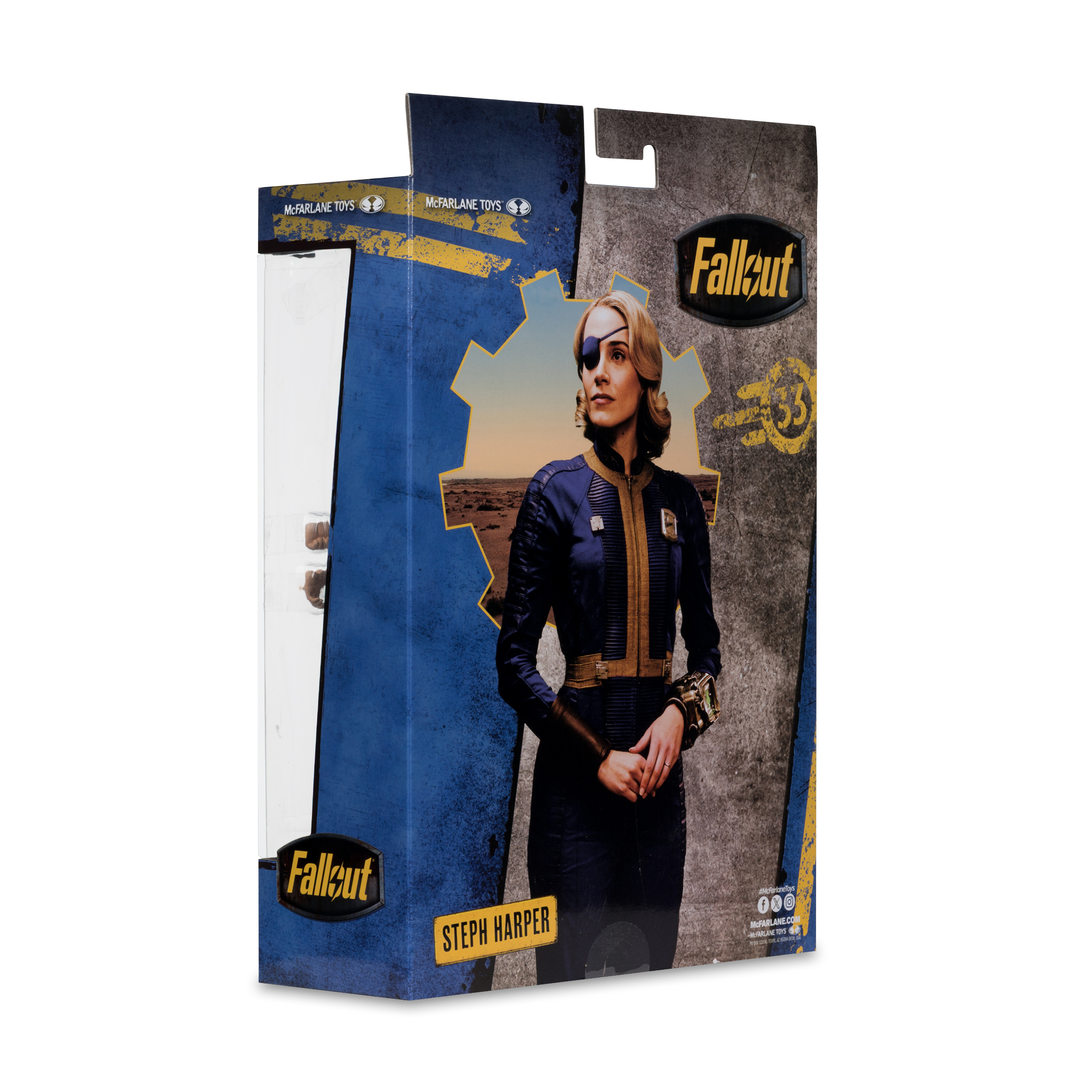 Una scatola di action figure di Fallout. Mostra Steph Harper, con un abito blu e una benda sull'occhio, con uno sfondo desertico.