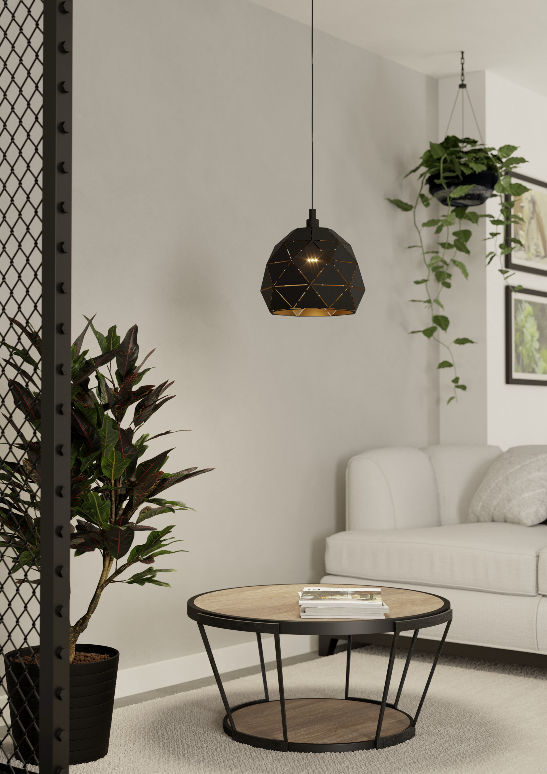 Salón con lámpara colgante, sofá, planta y mesa de centro con revistas.