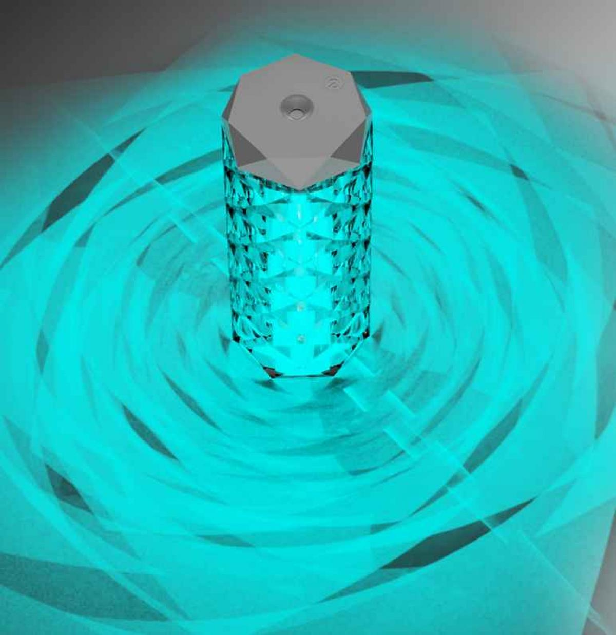 Eine dekorative Lampe mit facettiertem Glaskörper strahlt blaues Licht aus. Die Oberseite ist grau. Der Hintergrund zeigt wirbelndes blaues Licht.