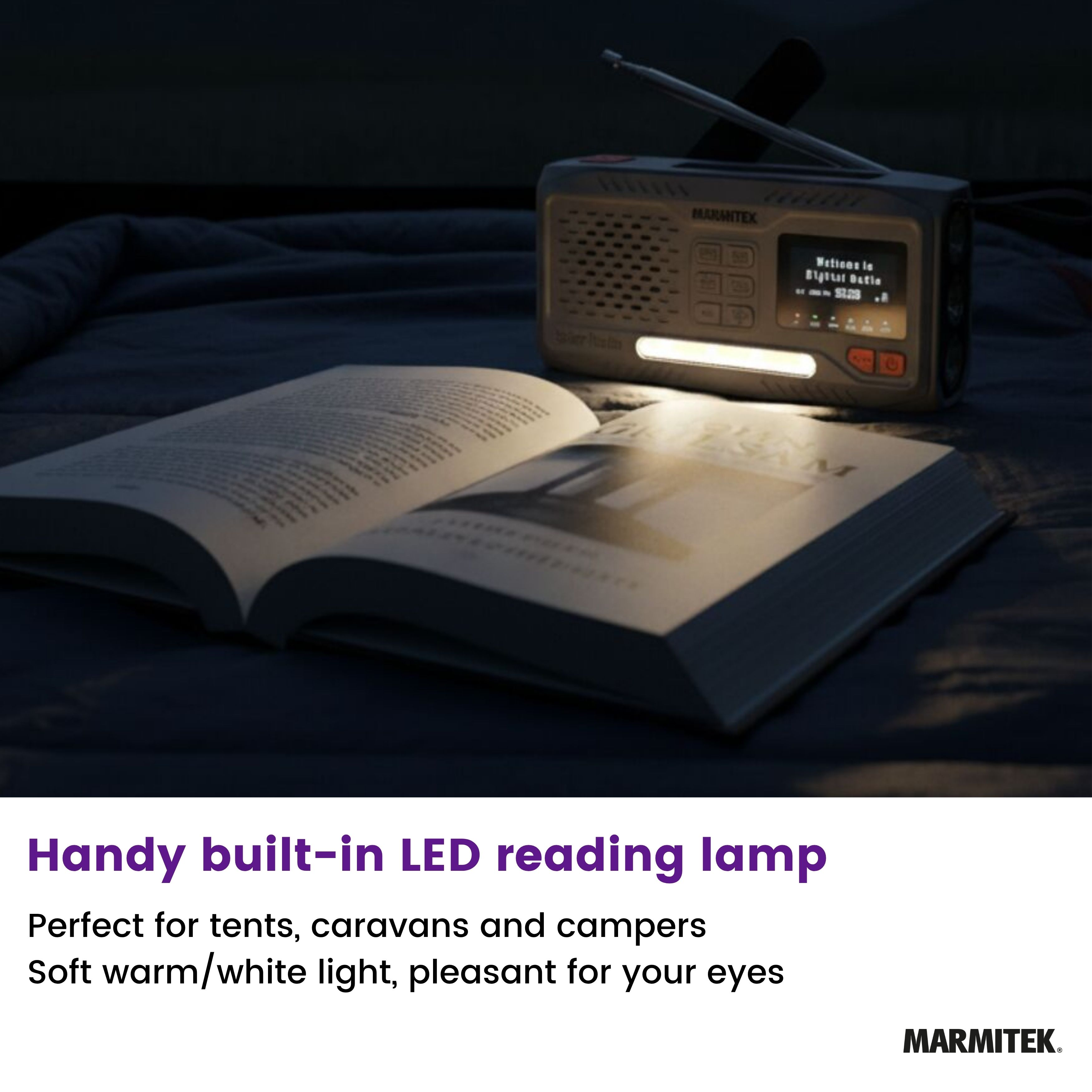 A radio and book are lit by an LED lamp. The book is open, the radio displays station info. Scene is on a bed.