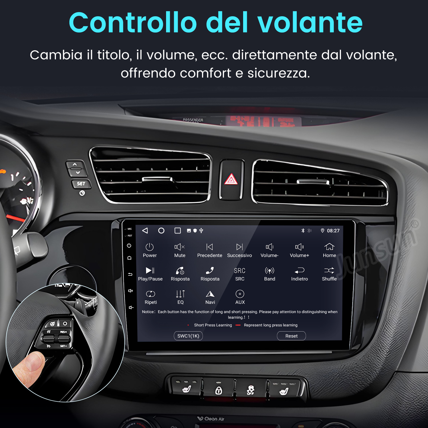 Cruscotto auto con display touchscreen, comandi al volante e vari pulsanti per audio e navigazione.