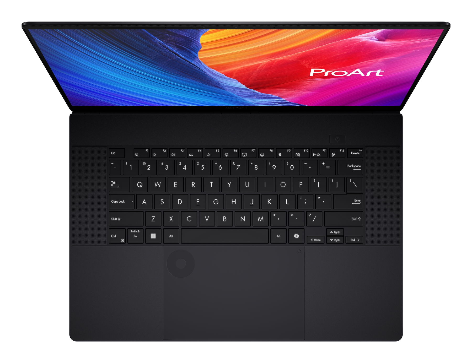 Un laptop nero con schermo aperto, che mostra un'immagine astratta colorata. La tastiera è visibile con il marchio ProArt sullo schermo.