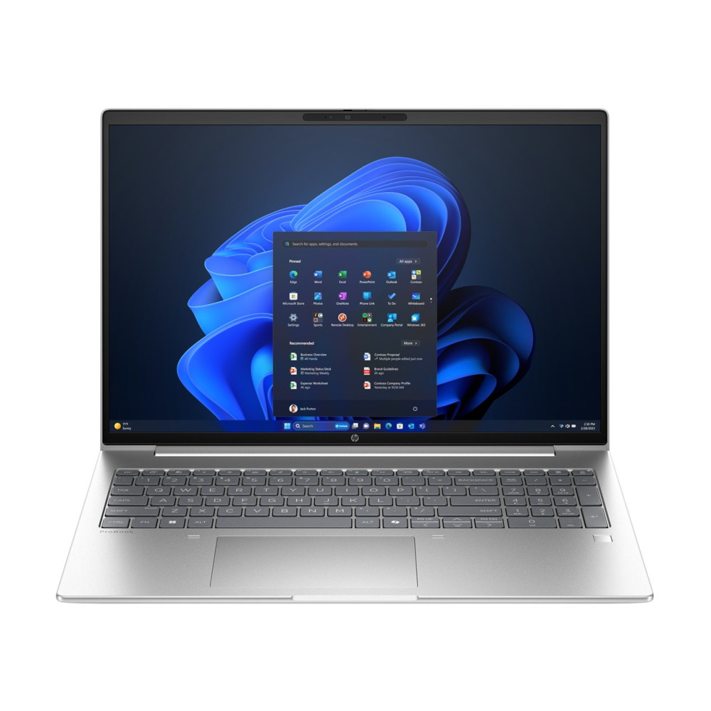 Otwarty srebrny laptop, wyświetlony interfejs Windows 11. Klawiatura widoczna. Ekran pokazuje aplikacje i dokumenty. Niebieskie i czarne tło.