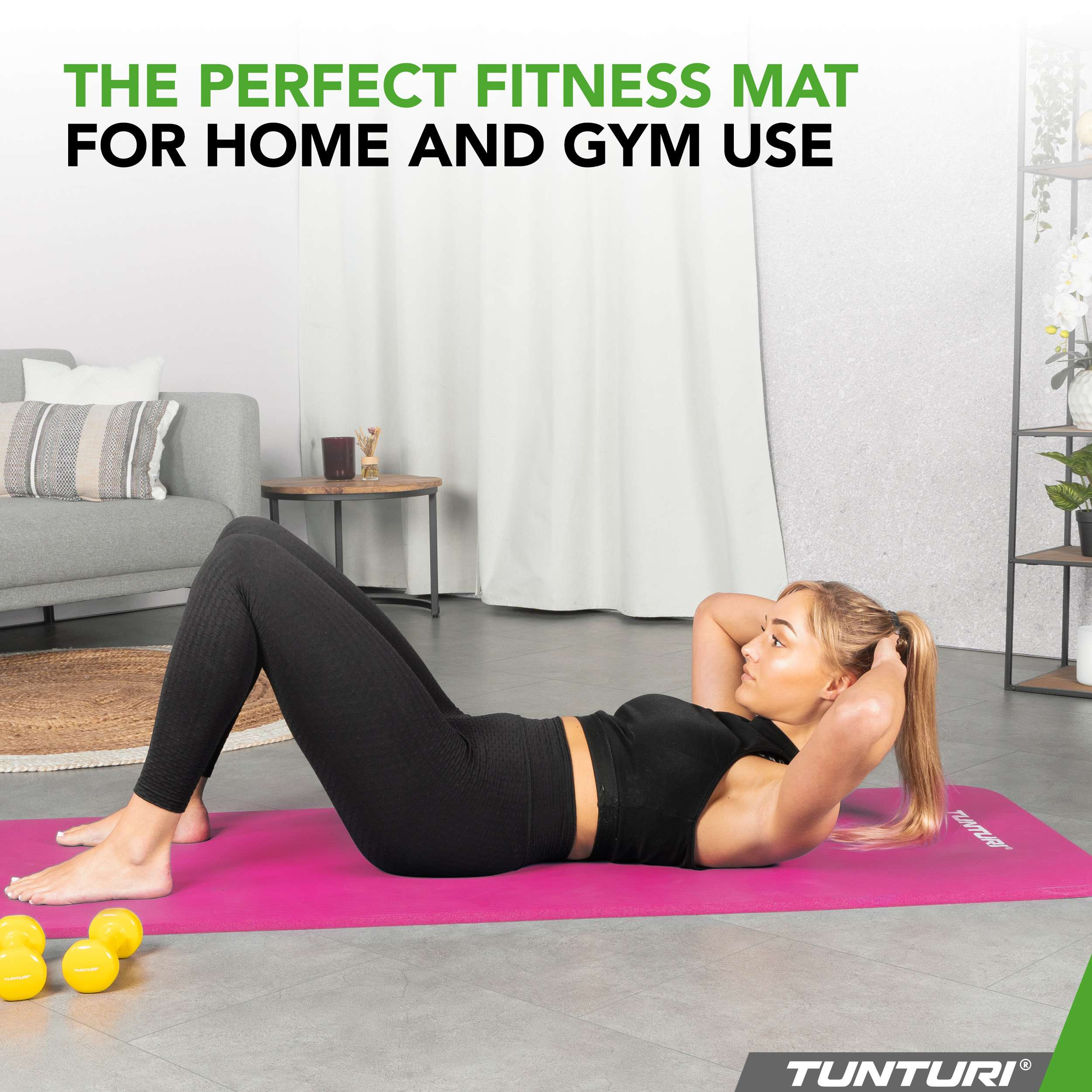 Woman doing sit-ups on a pink mat. Yellow weights are in the foreground. Background includes sofa and curtain.