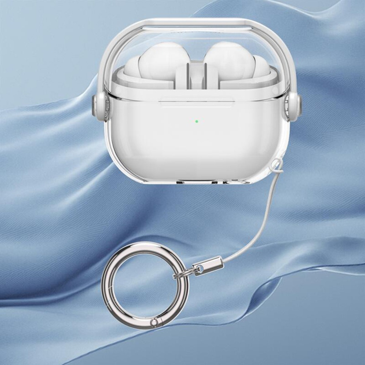 A white earbud case with transparent top. It has a silver ring. The background is a blue cloth.
