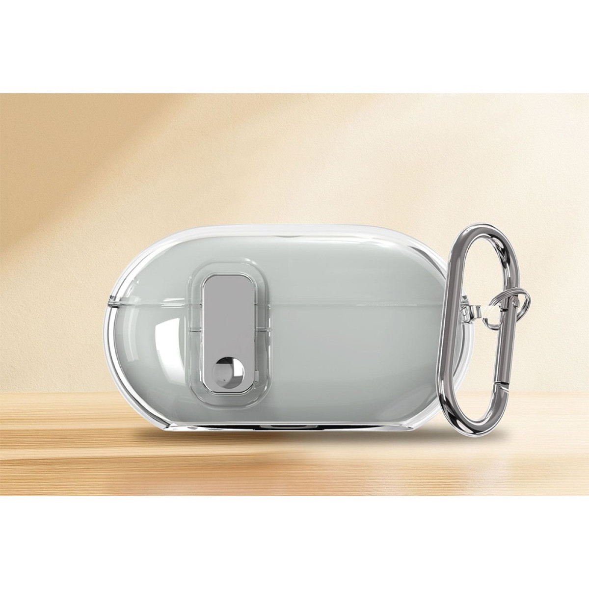 A clear case for earbuds on a wooden surface. It has a silver clasp and a light gray interior. The background is cream.