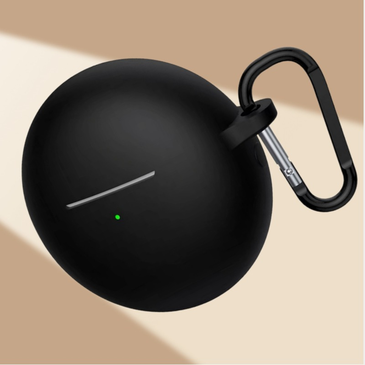 Black, oval earbud case with a silver accent and a green light. A black carabiner clip is attached. Tan background.
