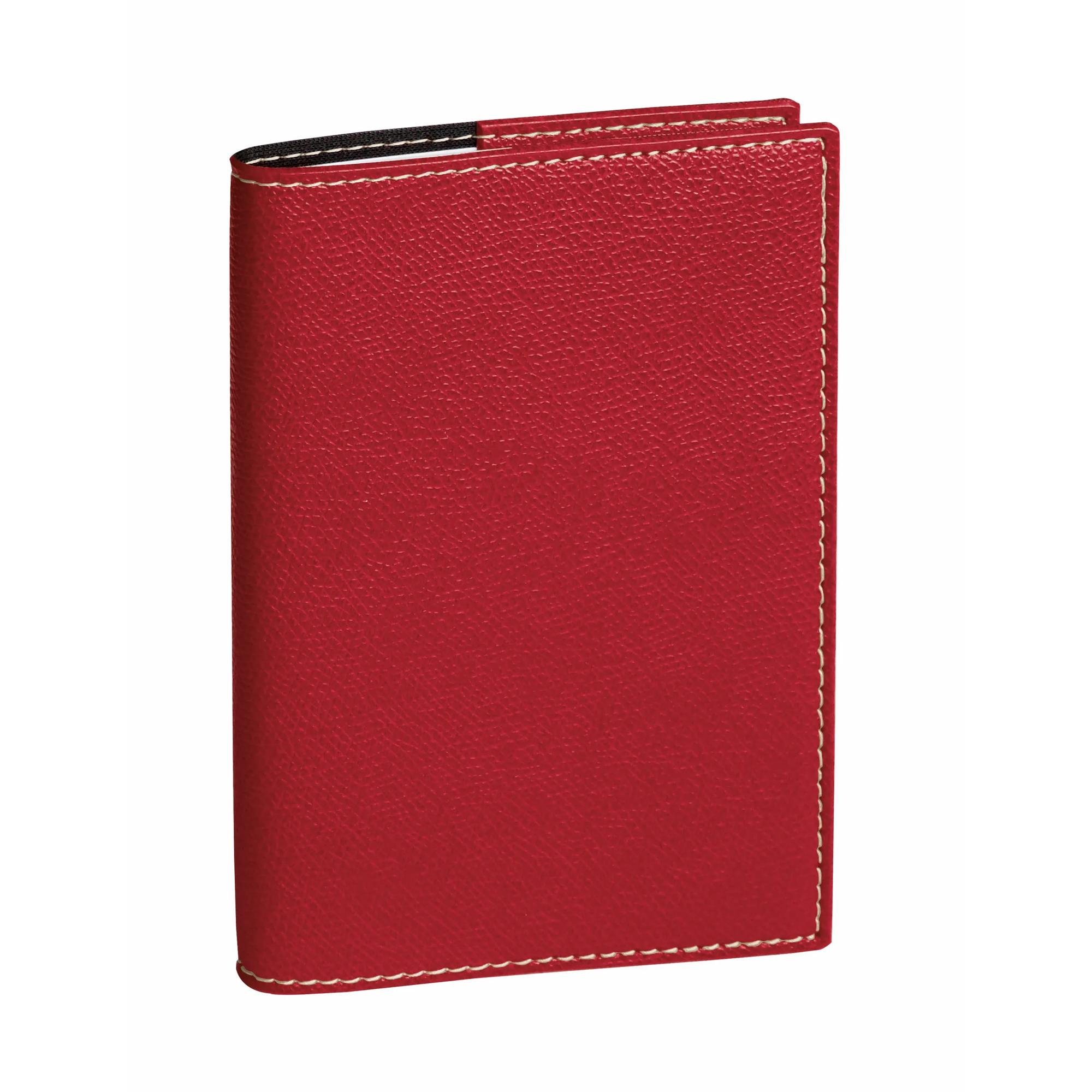 Una cartera de cuero roja con costuras blancas, de pie sobre un fondo blanco.