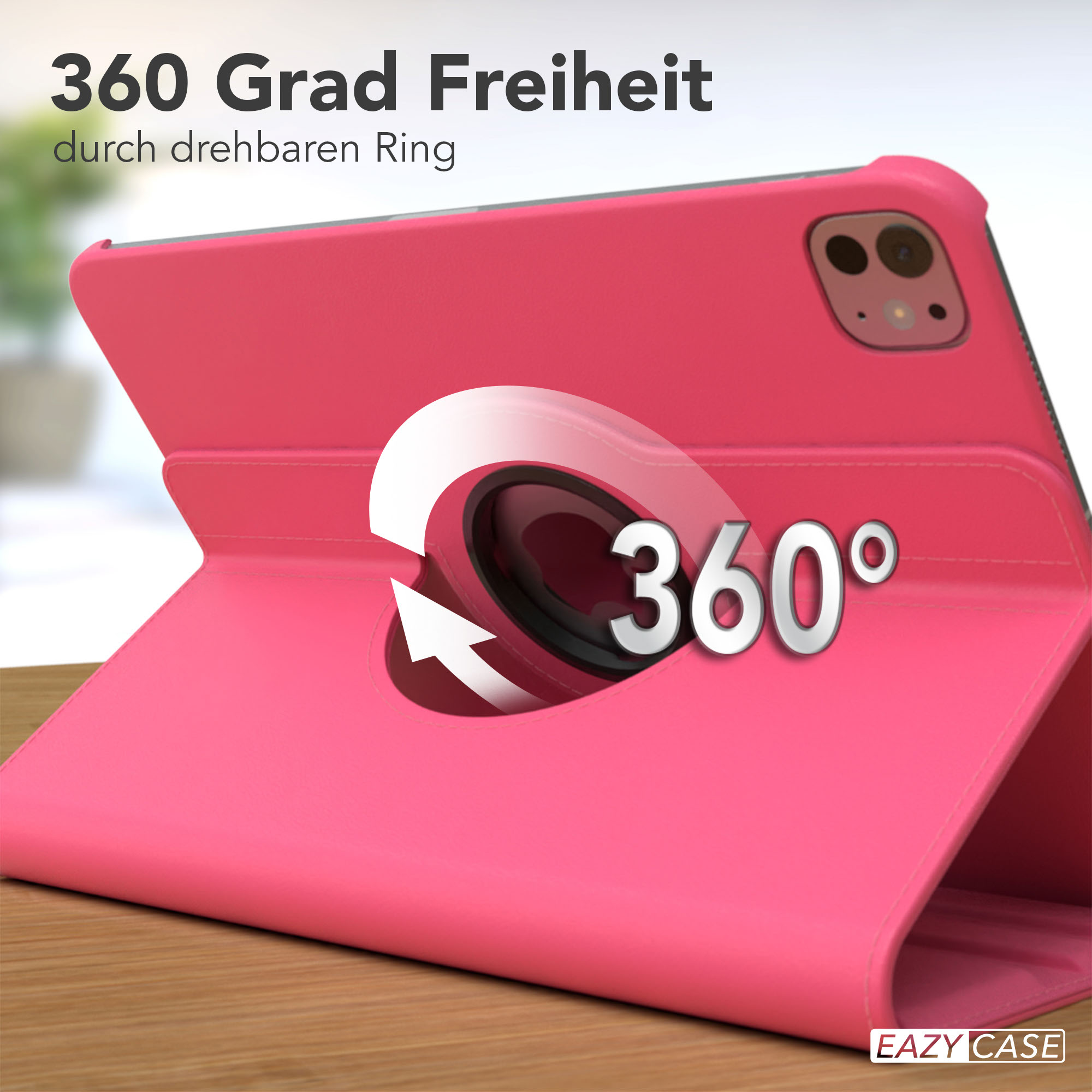 Eine pinkfarbene Tablethülle mit Drehring, der 360 Grad Freiheit bietet, auf einer Holzoberfläche.