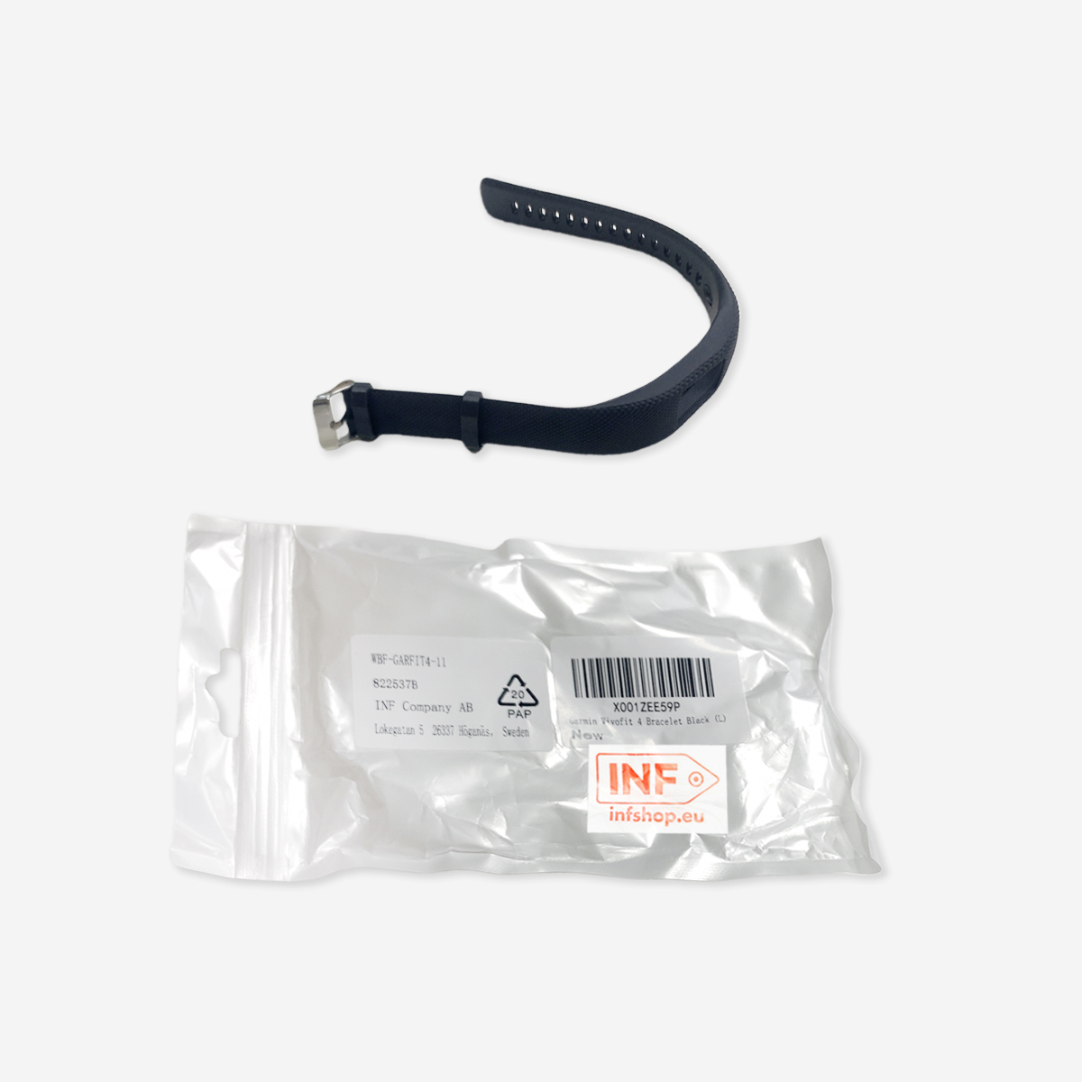 Czarny pasek do zegarka nad zamkniętą plastikową torebką z etykietą produktu. Pasek jest zakrzywiony i ma sprzączkę. Torba ma tekst.