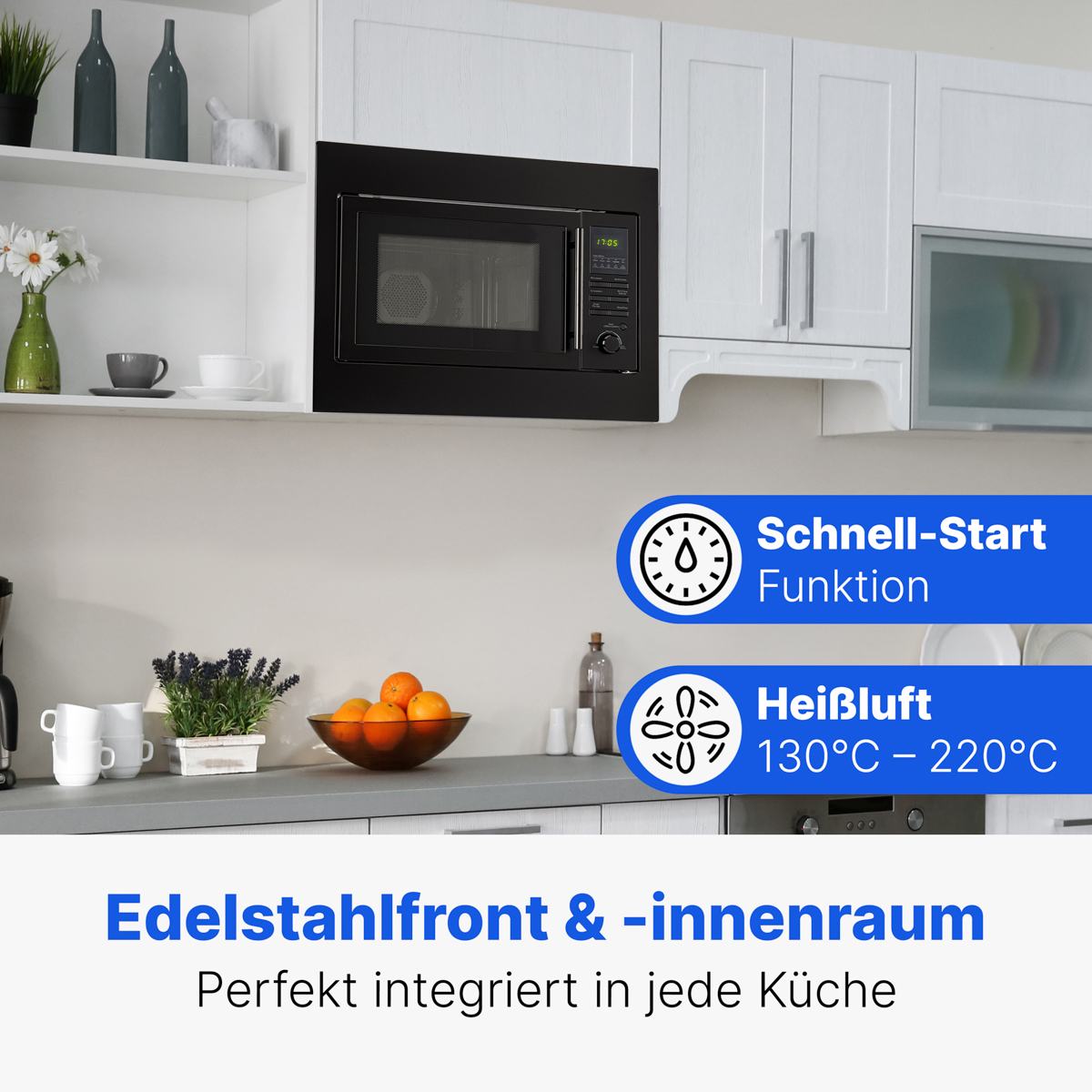 Moderne Küche mit eingebautem schwarzem Mikrowellenherd. Orangen in einer Schüssel und Text auf Deutsch.