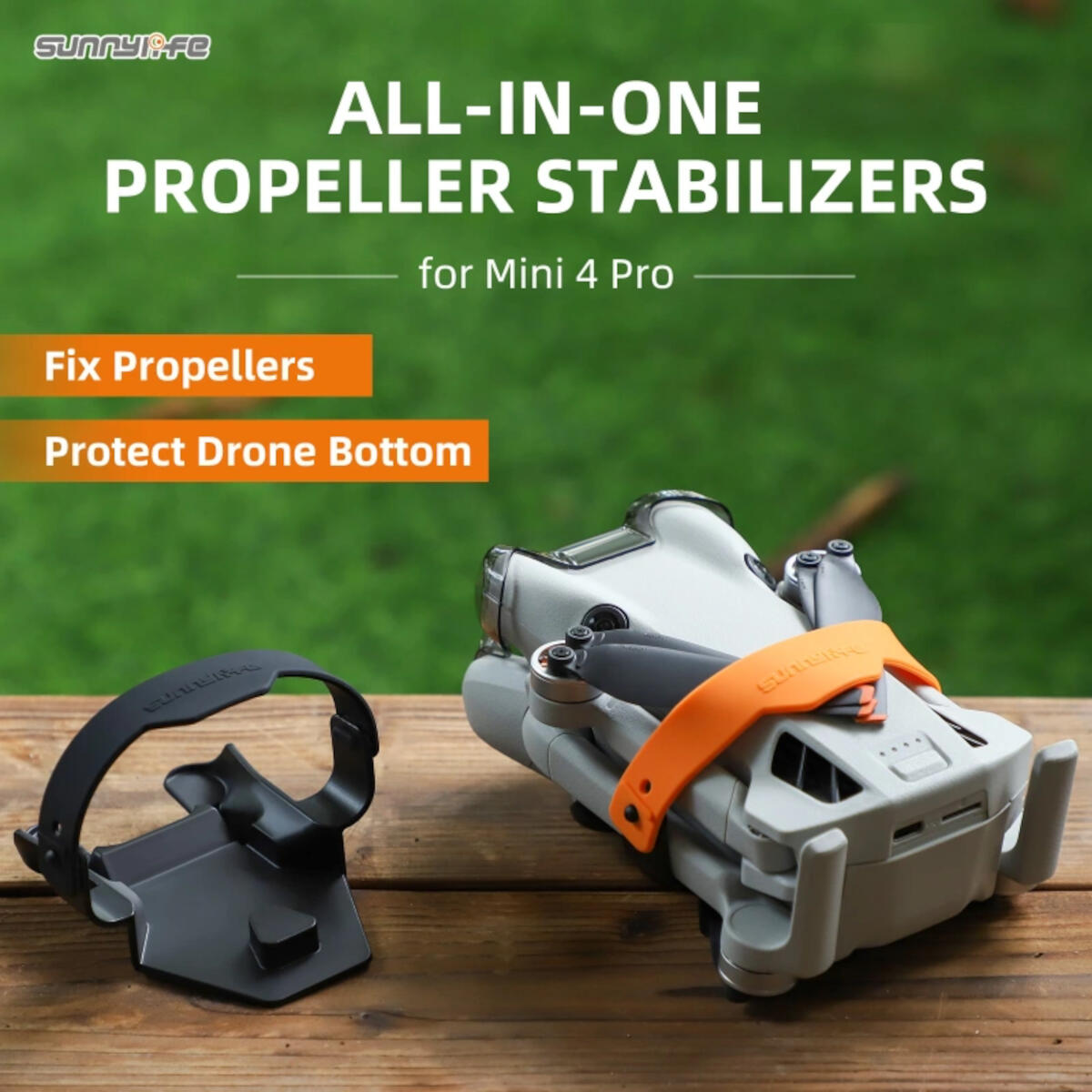 Un drone avec une bande orange et un support noir sur du bois. Le texte indique stabilisateurs d'hélice pour Mini 4 Pro.
