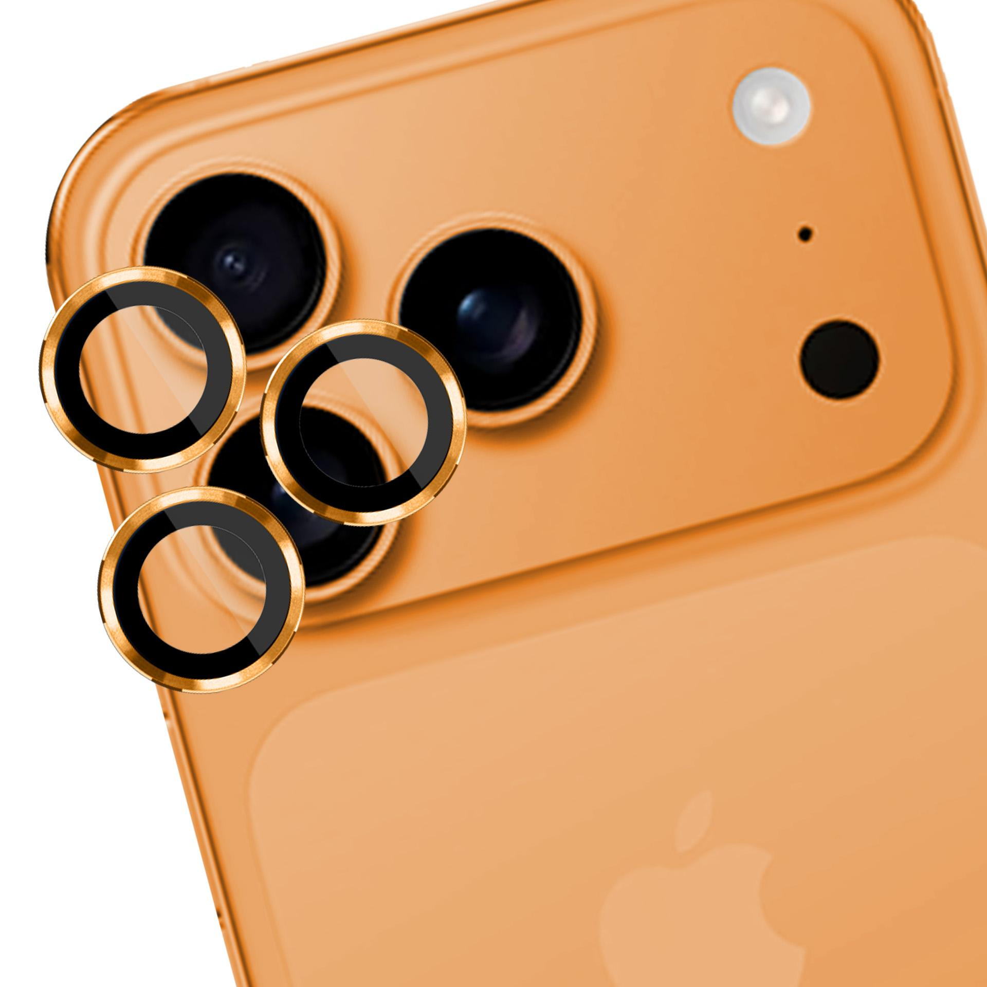 Un retro telefono arancione con tre obiettivi per fotocamera e tre anelli protettivi dorati. Il telefono ha un flash e un punto.