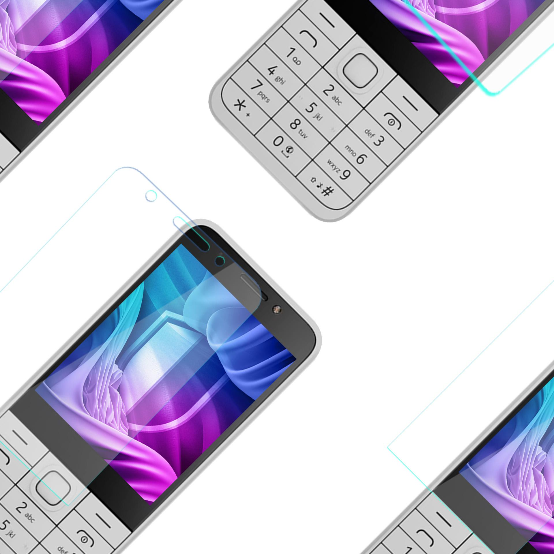 Primo piano di un telefono con tastiera bianca con protezione schermo applicata. Numeri e tasti visibili.