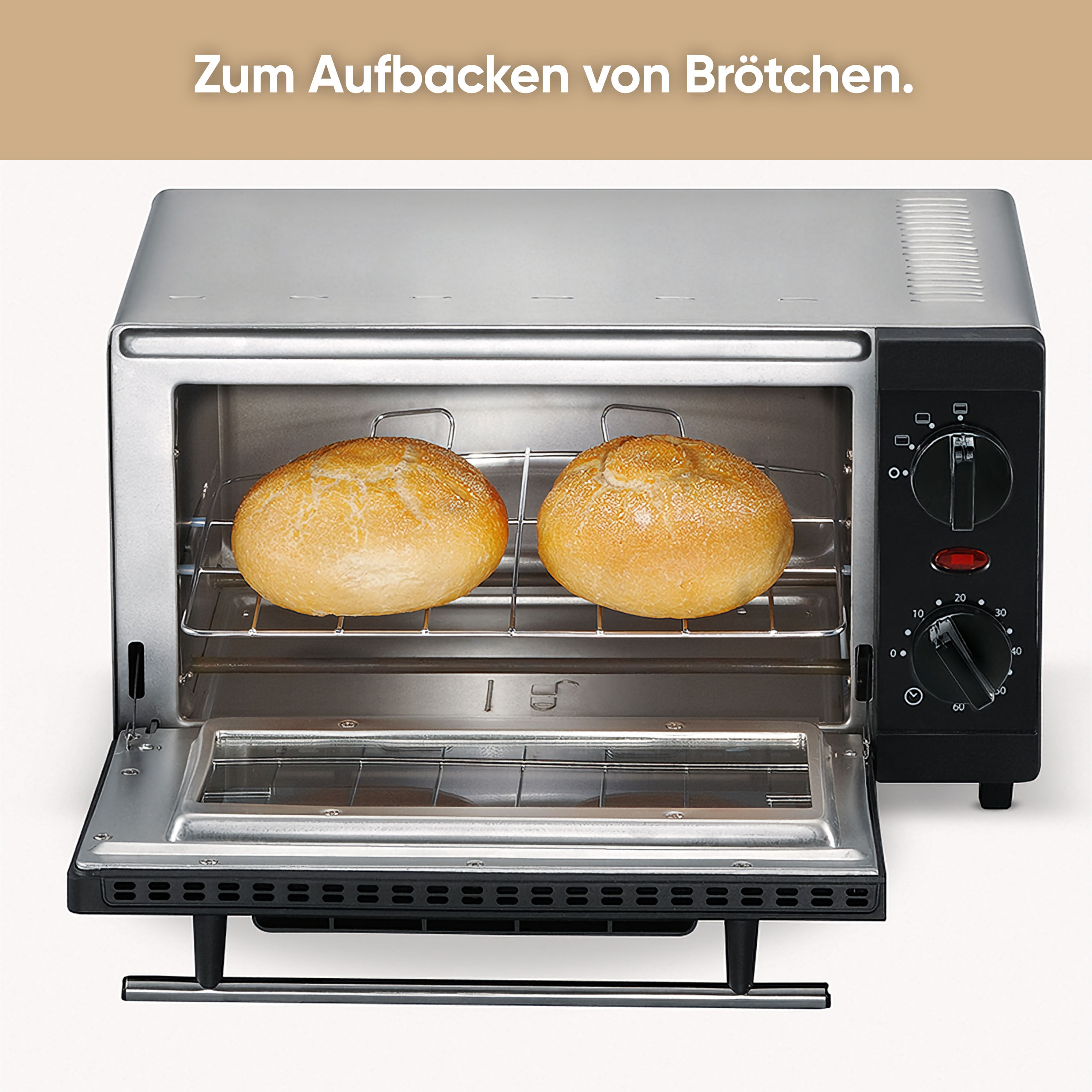 Toster z dwoma bułkami w środku. Piekarnik jest srebrny i czarny. Tekst: 'Do pieczenia bułek'.