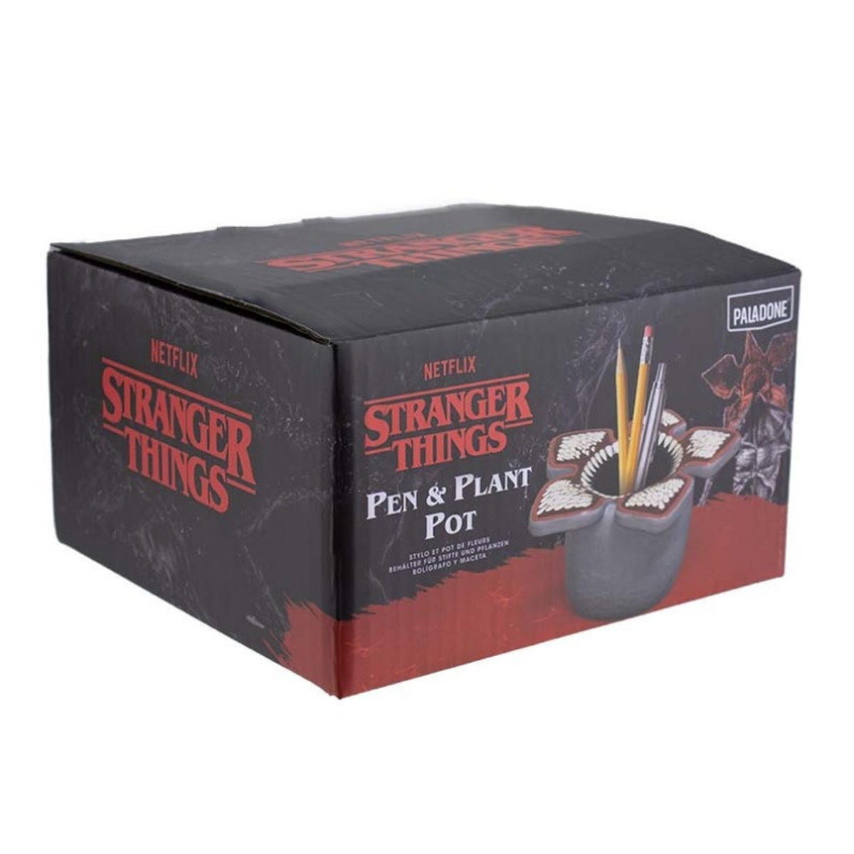 Ein 'Stranger Things' Stifte- und Pflanzentopf-Set in einer Box. Die Box ist schwarz mit rotem Text. Der Topf ist ein Demogorgon mit Stiften darin.
