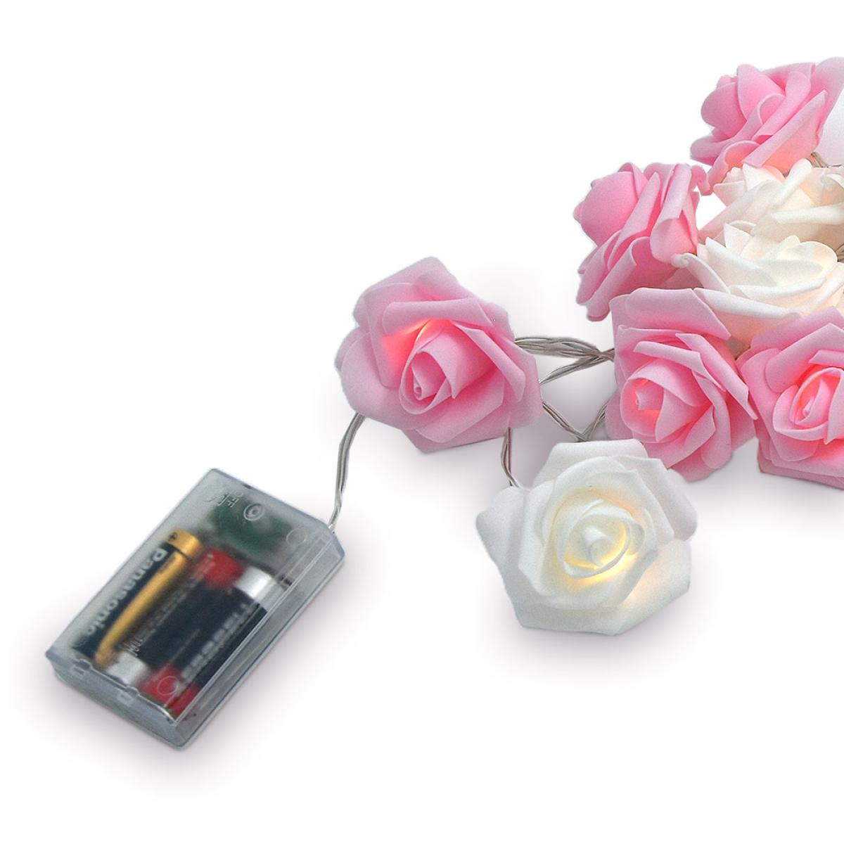 String of pink and white rose lights. A battery pack on the left powers the lights. Pink and white roses glow.