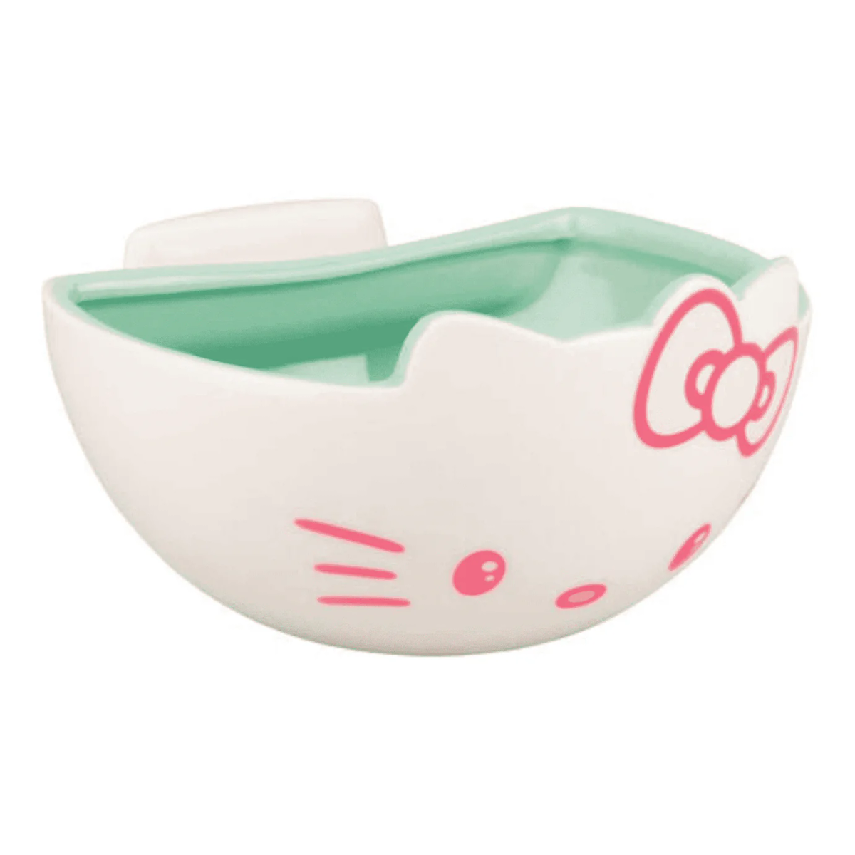 Un cuenco con forma de Hello Kitty. Blanco con detalles rosas, un lazo, bigotes y ojos. El interior es verde claro.