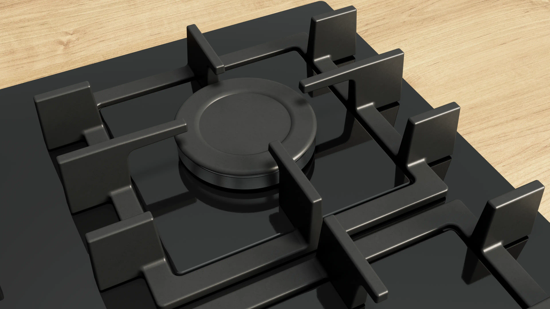 Zbliżenie czarnej kuchenki gazowej z centralnym palnikiem i czterema rusztami na drewnianej powierzchni.