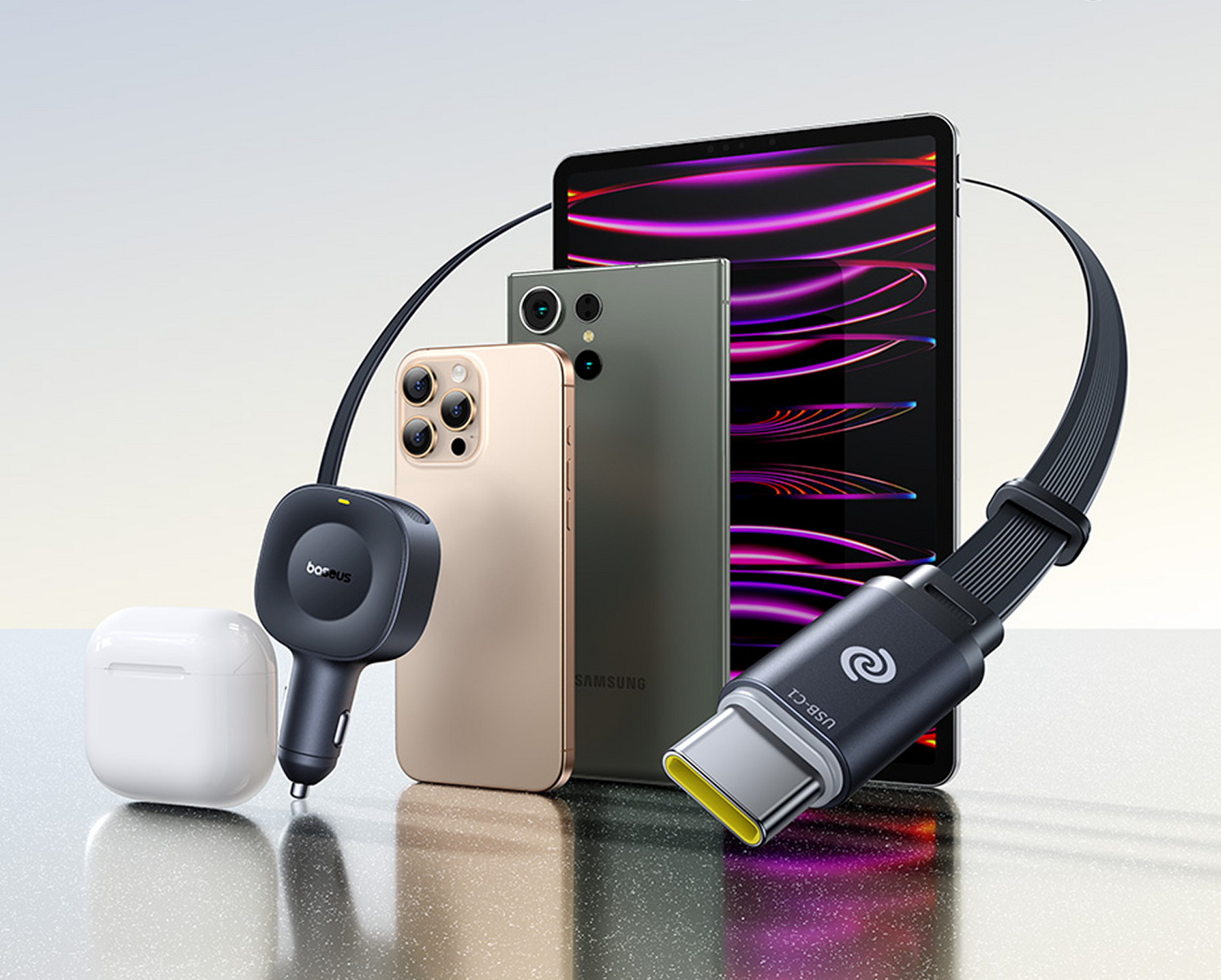 Vengono visualizzati un telefono, un tablet e un caricabatterie. Il caricabatterie è collegato al tablet. Sono visibili anche una custodia per auricolari e un telefono.